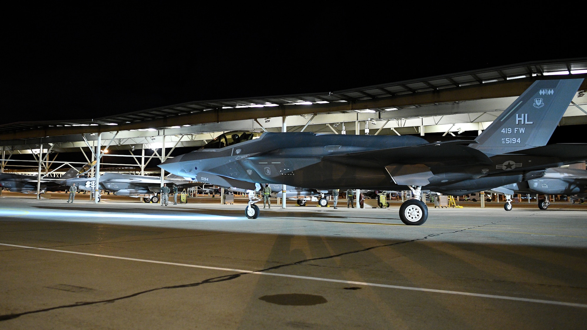 An F-35 pilot in the 419th Fighter Wing taxis his jet into formation before a nighttime takeoff for a deployment to Al Dhafra Air Base, United Arab Emirates last week from Hill Air Force Base, Utah