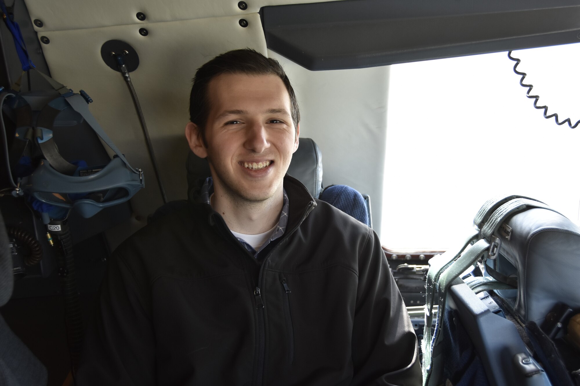 A civilian contractor from Hanscom Air Force Base, Massachusetts is all smiles aboard a C-5 Galaxy