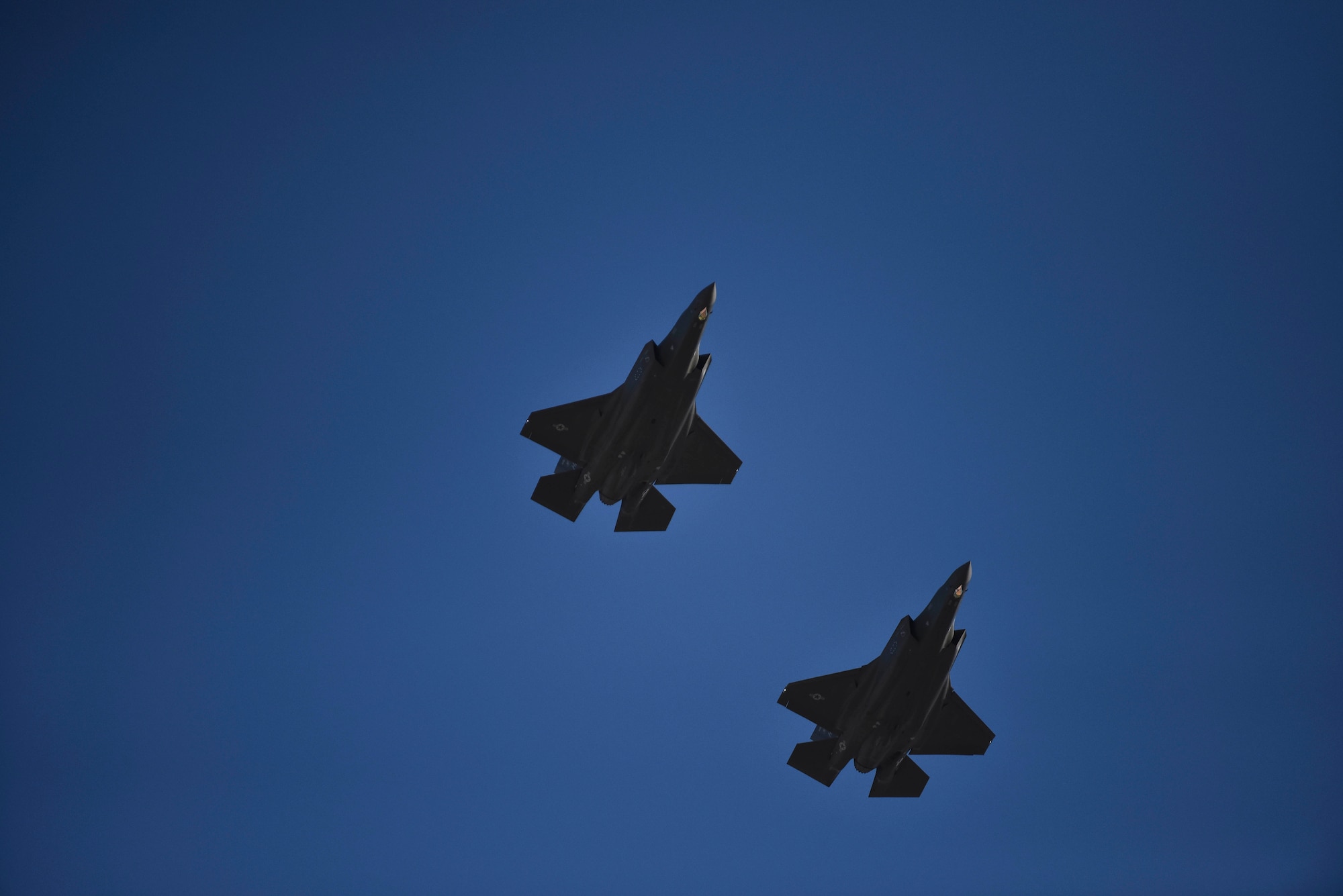 An image of two F-35A Lightning II's flying in the sky