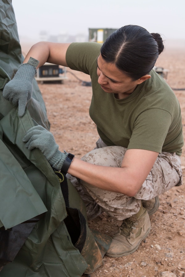 U.S. Navy Petty Officer 1st Class Viviana Garcia, a field medical technician with Special Purpose Marine Air-Ground Task Force-Crisis Response-Africa 19.1, Marine Forces Europe and Africa, sets up a medical tent during exercise African Lion 2019, in Tan Tan, Morocco, March 25, 2019. African Lion is an annual, multinational, joint-force exercise designed to improve interoperability and mutual understanding of each nation’s tactics, techniques and procedures while demonstrating a strong partnership between nation’s militaries. (U.S. Marine Corps photo by Cpl. Tessa D. Watts)