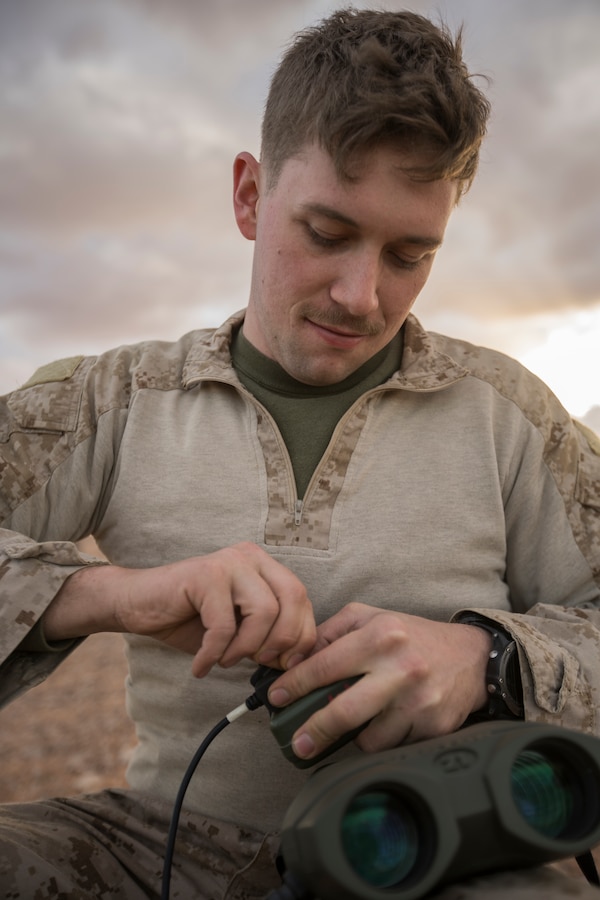 Lance Cpl. Jeffry Brady, a joint fires observer with 4th Air Naval Gunfire Liaison Company, connects a dagger to a Vector 21B rangefinder during exercise African Lion 2019 at Greir Labouihi range, Morocco, March 26, 2019. African Lion 2019 is an annual, combined-multilateral exercise designed to improve interoperability and mutual understanding of each nation’s tactics, techniques and procedures while demonstrating a strong partnership between nation’s militaries. (U.S. Marine Corps photo by Cpl. Niles Lee)