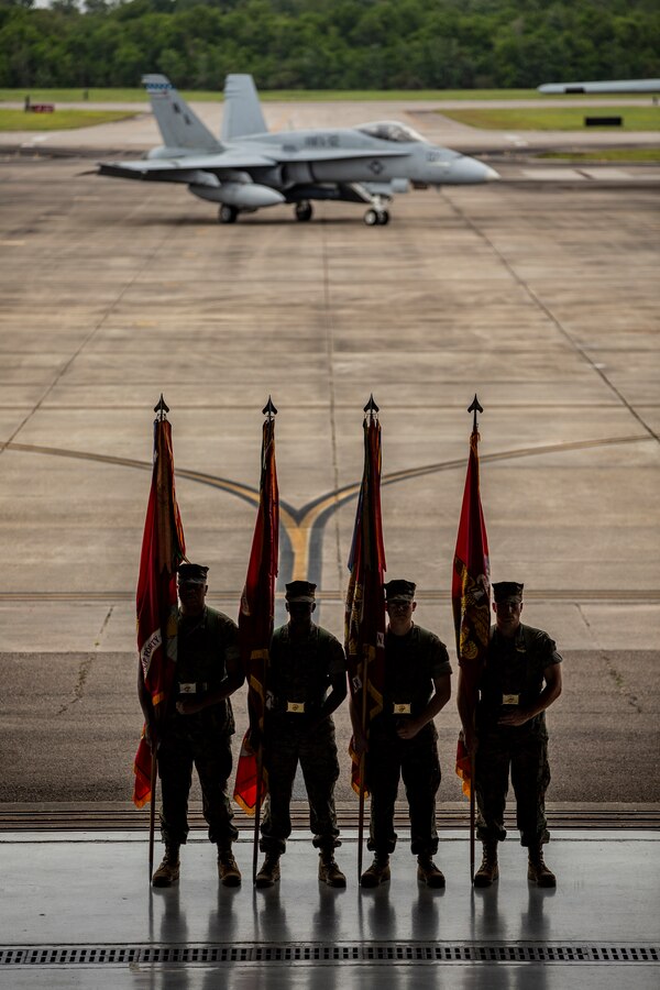 U.S. Marines with 4th Marine Aircraft Wing stand as part of a color guard prior to the 4th MAW change of command ceremony at Naval Air Station Joint Reserve Base New Orleans, April 13, 2019. The ceremony is a Marine Corps tradition to acknowledge a transfer of authority and responsibilities. 4th MAW relocated several times during Marine Corps history and formally was located in Glenview, Illinois, June 1, 1962. (U.S. Marine Corps photo by Lance Cpl. Jose Gonzalez)
