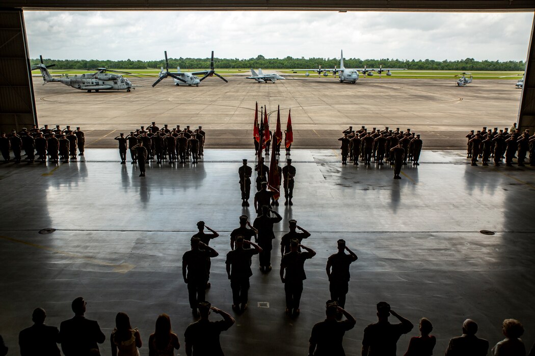 U.S. Marines with 4th Marine Aircraft Wing render honors during the 4th MAW change of command ceremony at Naval Air Station Joint Reserve Base New Orleans, April 13, 2019. The ceremony recognized Brig. Gen. Timothy L. Adams as the 43rd commanding general of 4th MAW. 4th MAW was activated 77 years ago on Aug. 22, 1942 at Ewa, Hawaii, as the 4th Marine Base Defense Aircraft Wing. (U.S. Marine Corps photo by Lance Cpl. Jose Gonzalez)