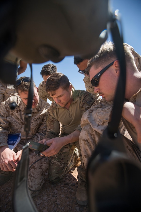 U.S. Marines with 4th Air Naval Gunfire Liaison Company listen to a class on nine-line medical evacuation procedures and calling close-air support during exercise African Lion 2019 at Greir Labouihi range, Morocco, March 27, 2019. African Lion 2019 is an annual, combined-multilateral exercise designed to improve interoperability and mutual understanding of each nation’s tactics, techniques and procedures while demonstrating a strong partnership between nation’s militaries. (U.S. Marine Corps photo by Cpl. Niles Lee)