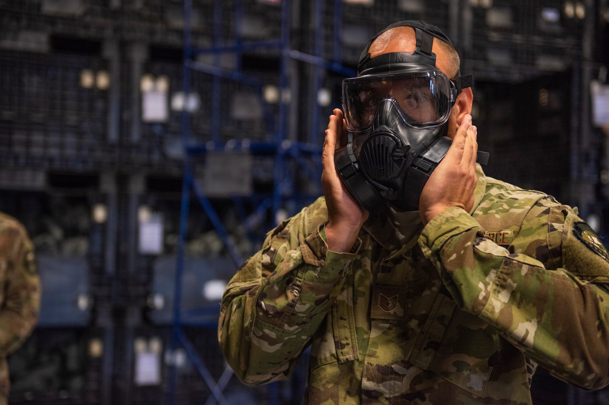 An Airman tests a gas mask April, 2, 2019, at Moody Air Force Base, Ga. From April 15-19, 2019, Moody executed a base-wide exercise that required players to function at a high operations tempo in a chemical, biological, radioactive and nuclear environment to meet Chief of Staff of the Air Force and the Commander of Air Combat Command’s intent for readiness. (U.S. Air Force photo by Airman 1st Class Joseph P. Leveille)