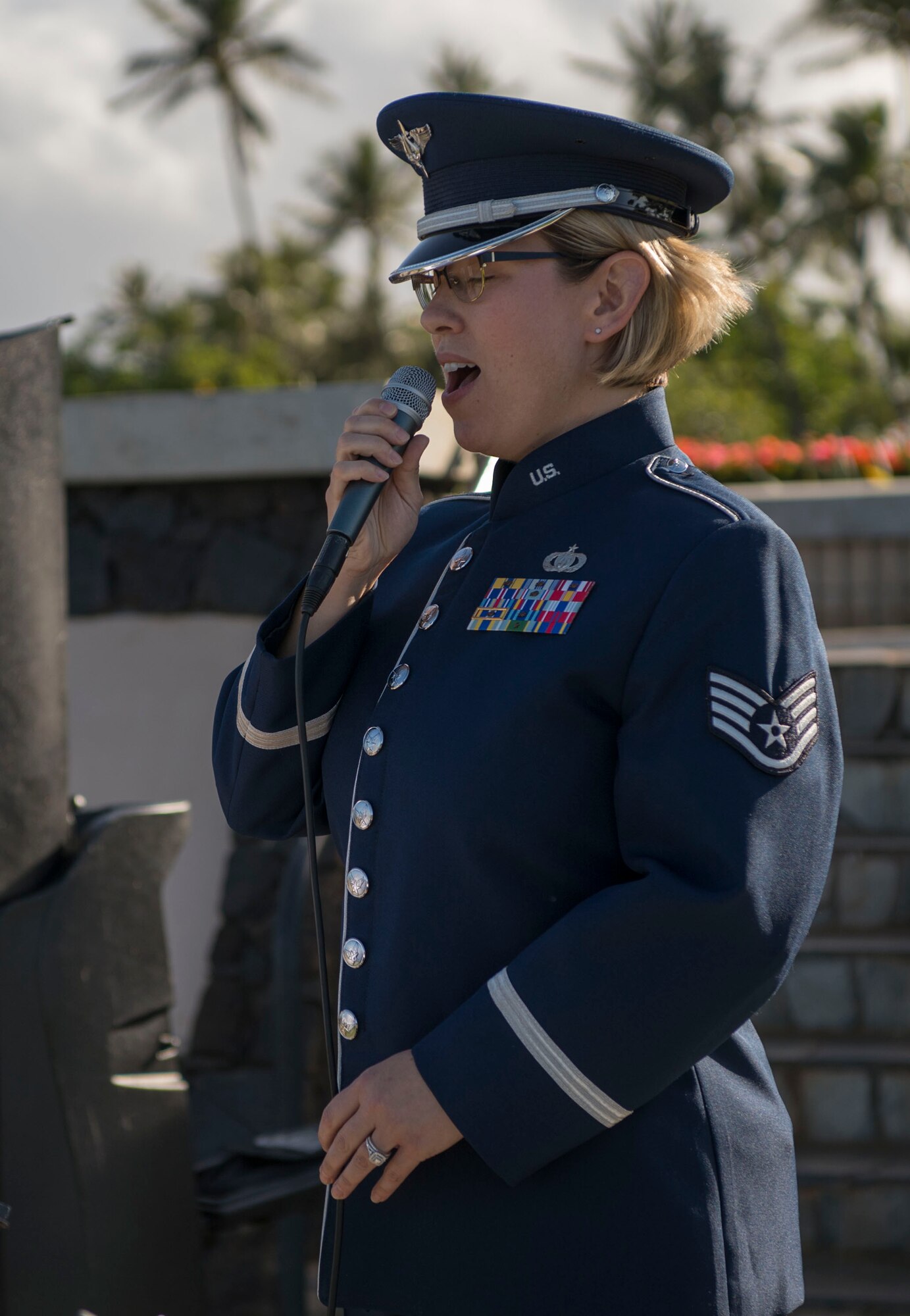 Staff Sgt. Rachel Wilson, U.S. Air Force Band of the Pacific vocalist, sings the national anthem during a memorial service held for retired Master Sgt. Byram Bates at the Missing Man Memorial on Joint Base Pearl Harbor-Hickam, Hawaii, April 12, 2019. Bates enlisted in the Army Air Forces in 1940 and was stationed at Hickam Field during the attack on Dec. 7, 1941. (U.S. Air Force photo by Tech. Sgt. Heather Redman)