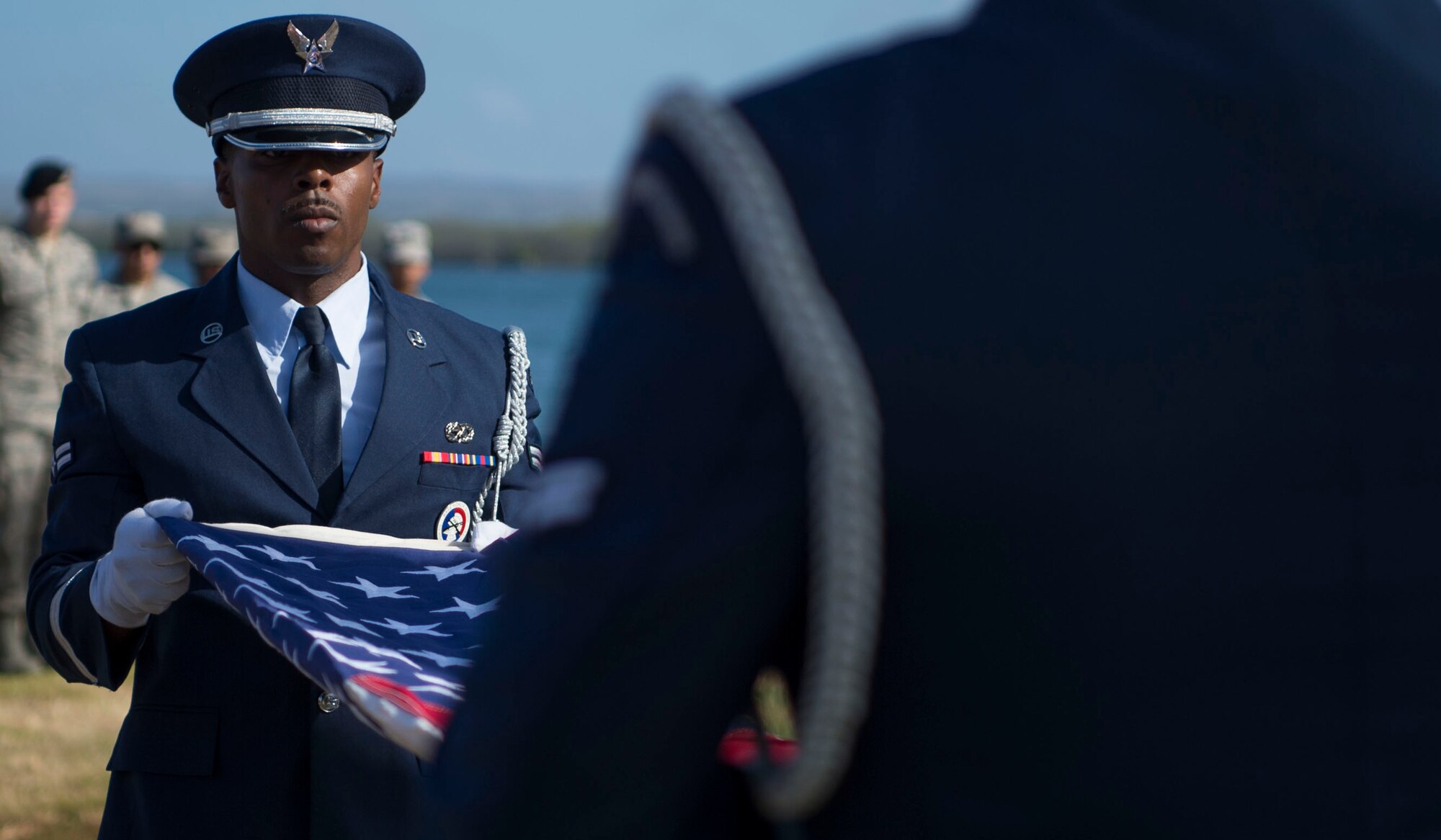 The 15th Wing Honor Guard performs a flag folding ceremony during a memorial service held for retired Master Sgt. Byram Bates at the Missing Man Memorial on Joint Base Pearl Harbor-Hickam, Hawaii, April 12, 2019. Bates was stationed at Hickam Field during the attack on Dec. 7, 1941, and went on to serve in the Pacific war front with the Army Air Forces in Eastern Mandates, Guadalcanal, Guam, Palau, Luzon, and the Southern Philippines. (U.S. Air Force photo by Tech. Sgt. Heather Redman)