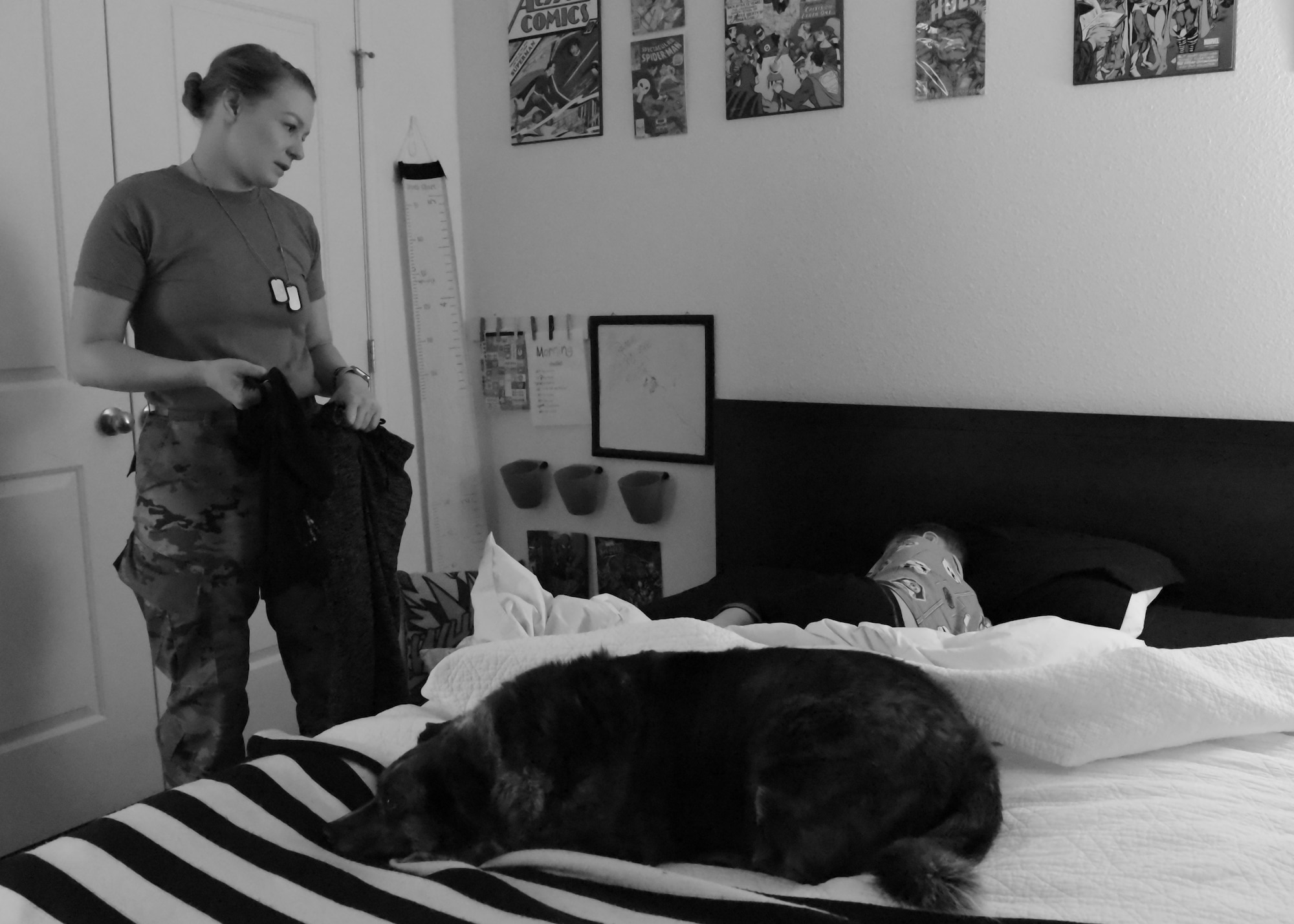 Airman 1st Class Megan Melvin, 90th Communications Squadron knowledge operations, waits for her son Reagan to get out of bed and put his clothes on for school, April 8, 2019, on F.E Warren Air Force Base, Wyo. Reagan, once he wakes up, is a hyper, fast-talking seven-year-old military kid. (U.S. Air Force photo by Airman 1st Class Braydon Williams)