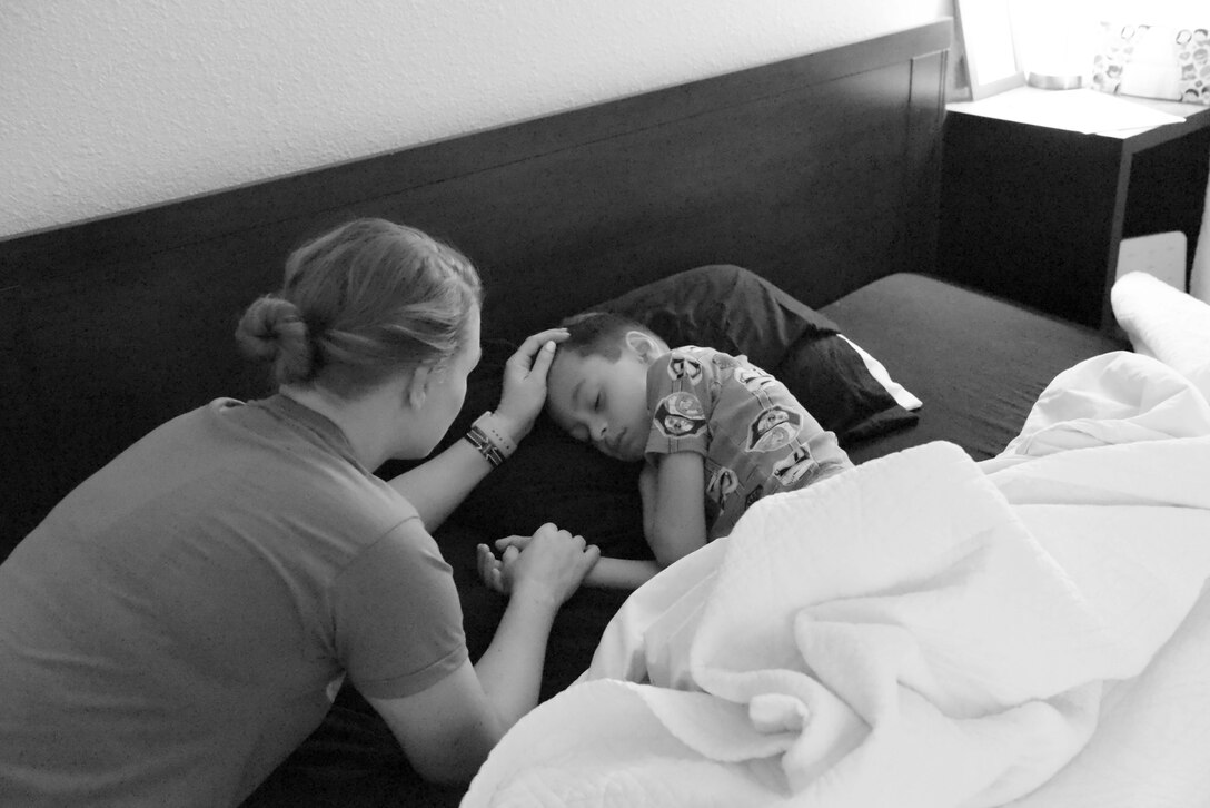 Airman 1st Class Megan Melvin, 90th Communications Squadron knowledge operations, single mother of a military child, wakes her son Reagan for school April 8, 2019, on F.E. Warren Air Force Base, Wyo. Reagan is the son of a single parent, he is active throughout the week with gymnastics twice a week and jujitsu four times a week. (U.S. Air Force photo by Airman 1st Class Braydon Williams)