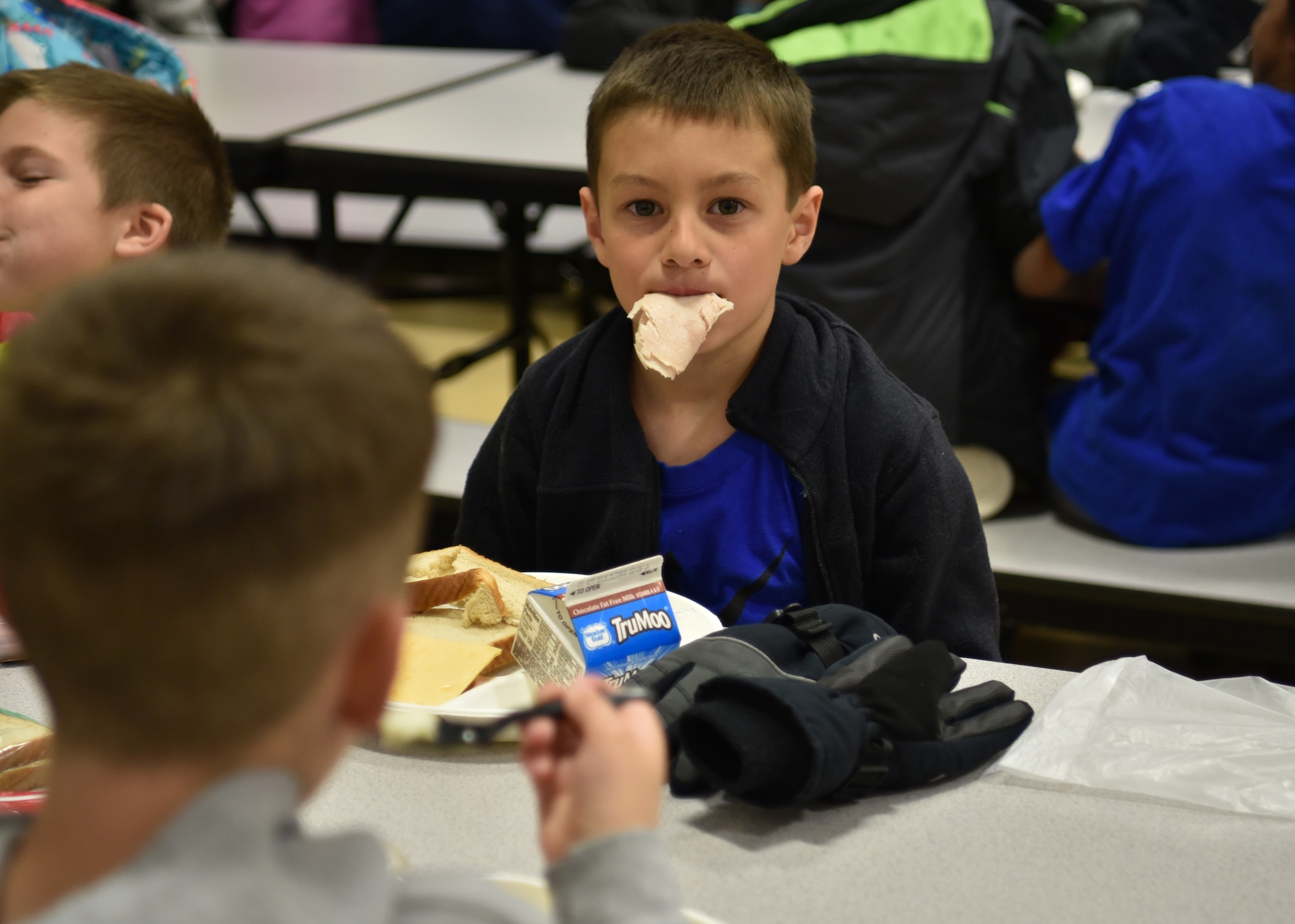 Reagan eats lunch at school, April 15, 2019, in Cheyenne, Wyo. Reagan like most seven-year-olds loves to play games and not do his homework, despite that, he does what he is told to do. (U.S. Air Force photo by Airman 1st Class Braydon Williams)