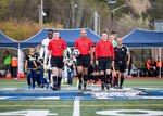 NAVAL STATION EVERETT, Wa. (April 14, 2019) - Navy and Marein Corp. soccer teams head on to the field for day one of the 2019 Armed Forces Men's Soccer Championship hosted at Naval Station Everett, Wa. from 14-20 April, featuring Service members from the Army, Marine Corps, Navy (including Coast Guard) and Air Force. (U.S. Navy Photo by Mass Communicaton Specialist 2nd Class Ian Carver/RELEASED).