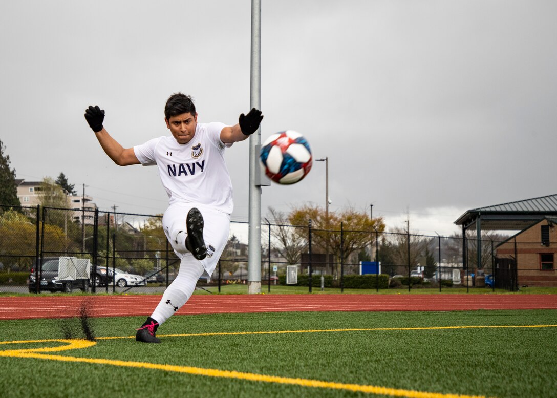NAVAL STATION EVERETT, Wa. (April 14, 2019) - Petty Officer 3rd Class Jonathan Tovar, stationed at Pearl Harbor, Hi., kicks the corner kick during the Navy’s first round match against the Marine Corp. at the Armed Forces Sports Men’s Soccer Championship hosted at Naval Station Everett. (U.S. Navy Photo by Mass Communication Specialist 2nd Class Ian Carver/RELEASED).