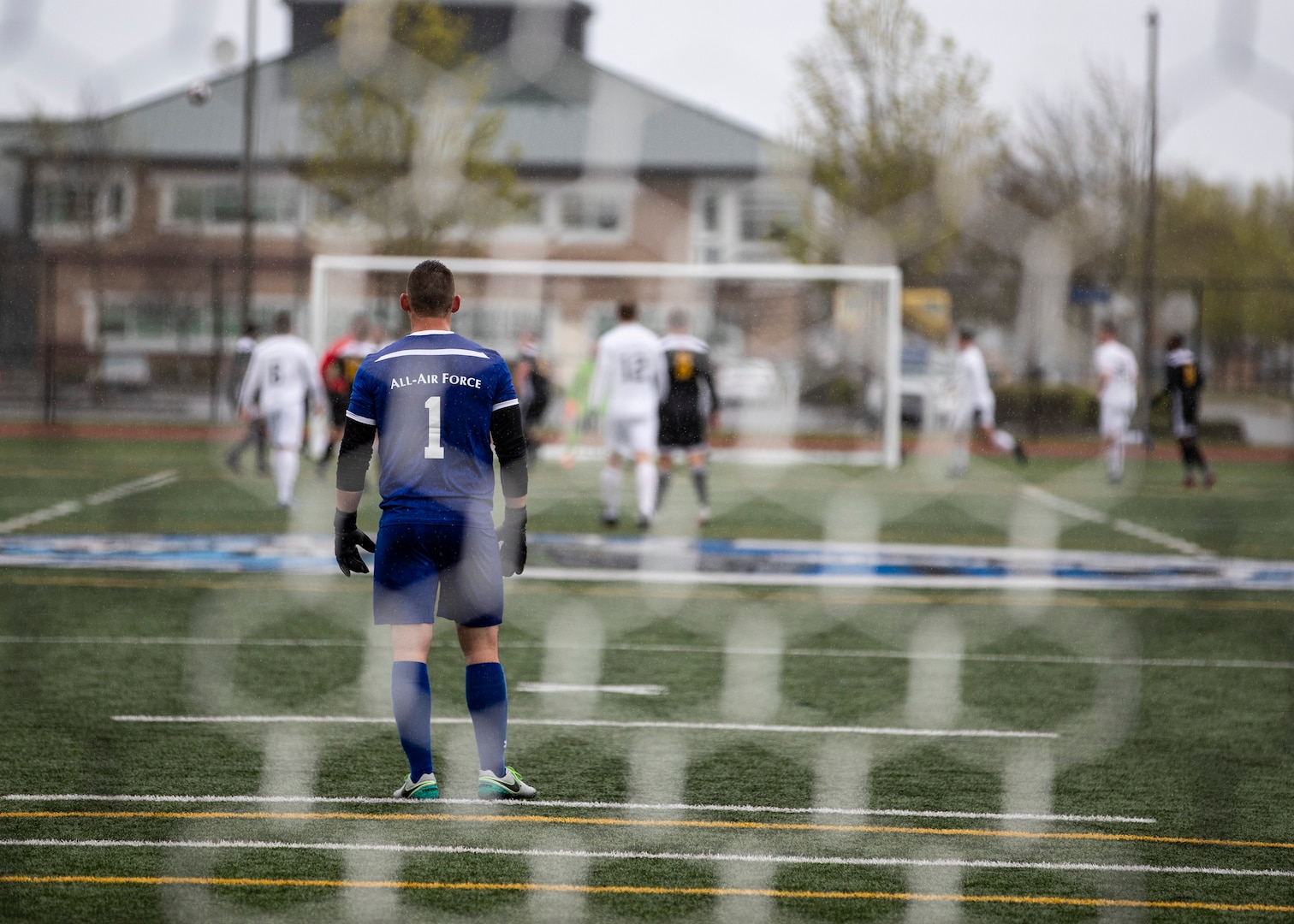 NAVAL STATION EVERETT, Wa. (April 14, 2019) - Airman 1st Class Benjamin Lockler, stationed at Grand Forks, ND. watches as his Air Force team competes agains the Army team during the first round of the Armed Forces Sports Men’s Soccer Championship hosted at Naval Station Everett. (U.S. Navy Photo by Mass Communication Specialist 2nd Class Ian Carver/RELEASED).  190414-N-XK513-1151