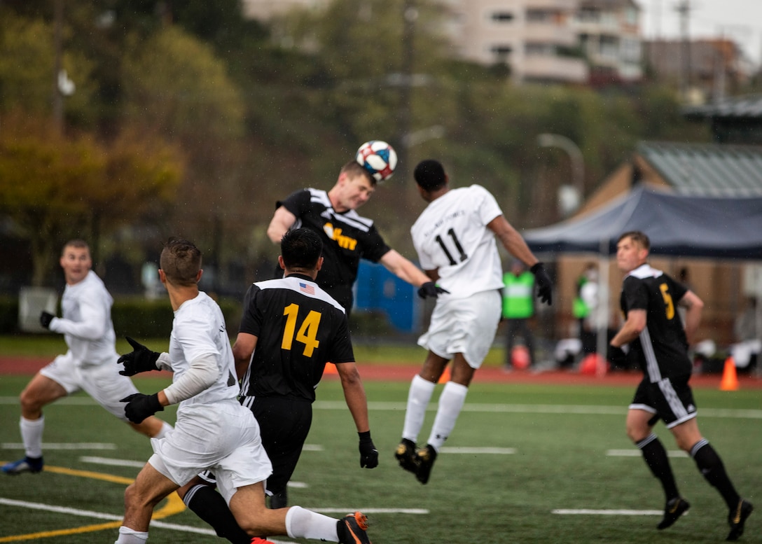 NAVAL STATION EVERETT, Wa. (April 14, 2019) - Players from the Army and Navy soccer teams compete in the opening match of the Armed Forces Sports Men’s Soccer Championship hosted at Naval Station Everett. (U.S. Navy Photo by Mass Communication Specialist 2nd Class Ian Carver/RELEASED). 190414-N-XK513-1438