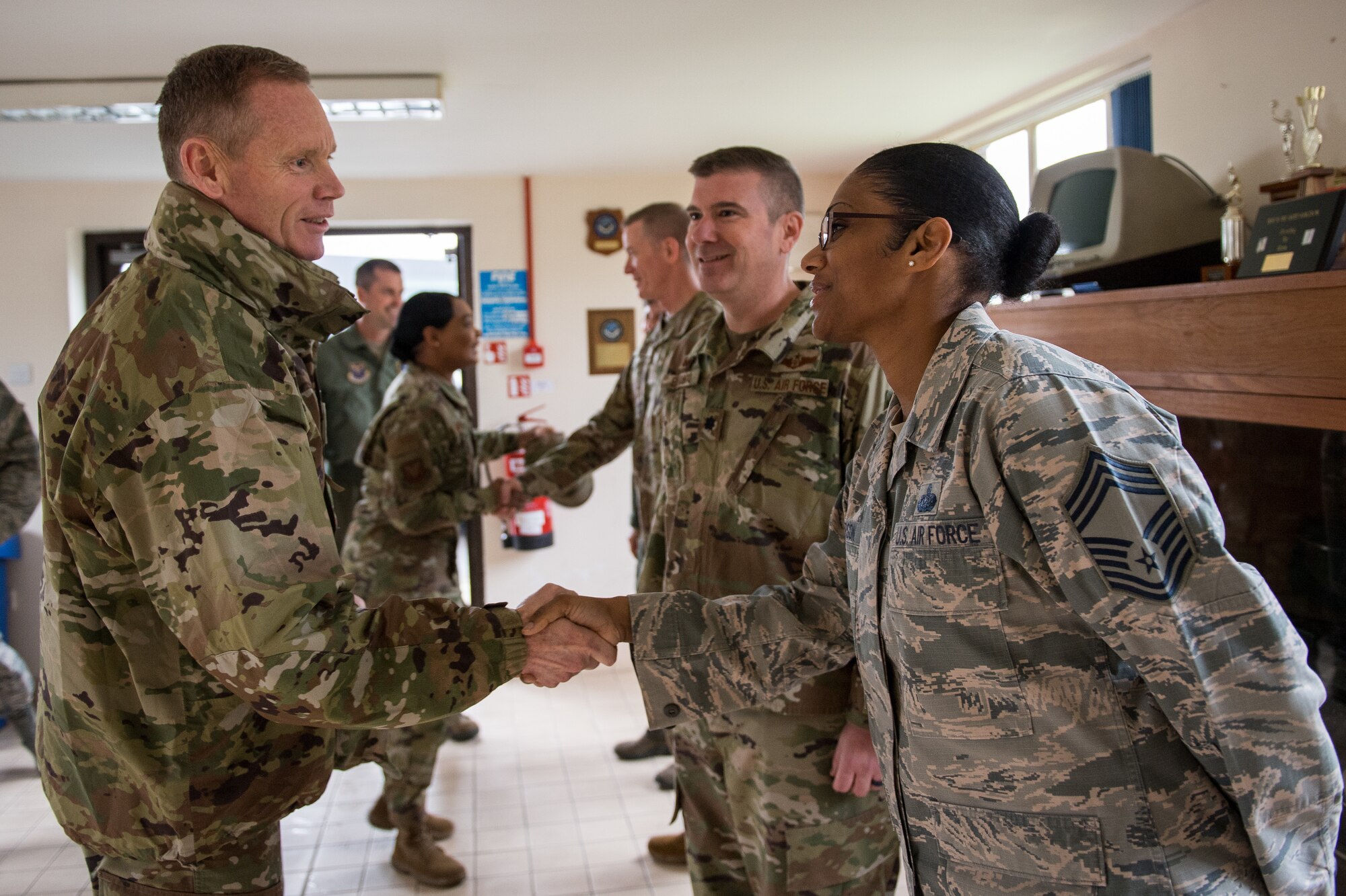 Maj. Gen. James Dawkins Jr., Eighth Air Force and Joint-Global Strike Operations Center commander, shakes hands with Chief Master Sgt. Christy Peterson, Bomber Task Force Mission Support Group superintendent deployed from Barksdale Air Force Base, La., after his arrival at RAF Fairford, England, April 4, 2019. Dawkins visited the base during a U.S. Strategic Command Bomber Task Force in Europe. (U.S. Air Force photo by Airman 1st Class Tessa B. Corrick)