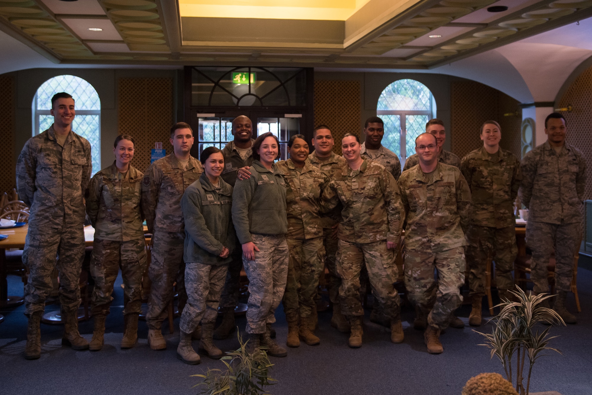 Airmen deployed from Barksdale Air Force Base, La., pose for a photo with Chief Master Sgt. Melvina Smith, Eighth Air Force command chief, at RAF Fairford, England, April 4, 2019. The group of Airmen were selected to have lunch with Smith during her visit to the base. (U.S. Air Force photo by Airman 1st Class Tessa B. Corrick)