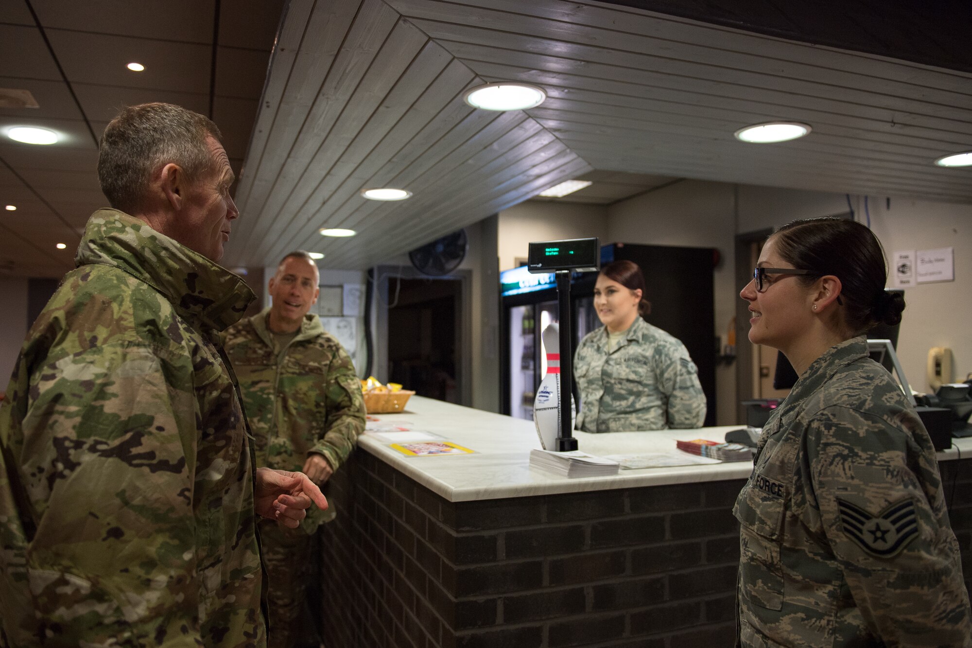 Maj. Gen. James Dawkins Jr., Eighth Air Force and Joint-Global Strike Operations Center commander (far left), and Brig. Gen. Tom Wilcox, Air Force Global Strike Command operations and communications director (center left), speak with Staff Sgt. Kelli Lewis, 2nd Force Support Squadron community partnership programs office craftsman (far right), and Senior Airman Katelyn Kent, 2nd FSS fitness journeyman (center right), both deployed from Barksdale Air Force Base, La., at RAF Fairford, England, April 4, 2019. Dawkins and Wilcox spent the day traveling around base to talk to Airmen regarding their time and efforts supporting a U.S. Strategic Command Bomber Task Force in Europe. (U.S. Air Force photo by Airman 1st Class Tessa B. Corrick)