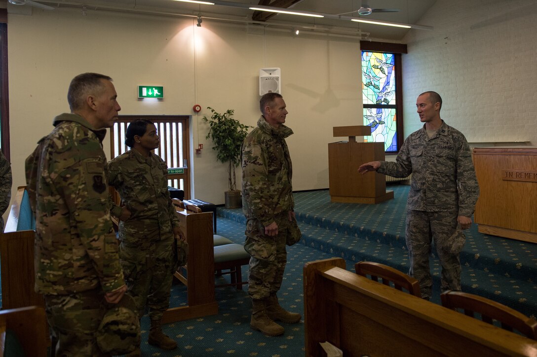 Chaplain (Capt.) Mitchell Holley, Bomber Task Force chaplain deployed from Barksdale Air Force Base, La., briefs Maj. Gen. James Dawkins Jr., Eighth Air Force and Joint-Global Strike Operations Center commander, Brig. Gen. Tom Wilcox, Air Force Global Strike Command operations and communications director and Chief Master Sgt. Melvina Smith, Eighth Air Force command chief, at RAF Fairford, England, April 4, 2019. Holley provided the leadership team with a tour of the facility and talked about what the facility had been used for during the BTF. (U.S. Air Force photo by Airman 1st Class Tessa B. Corrick)