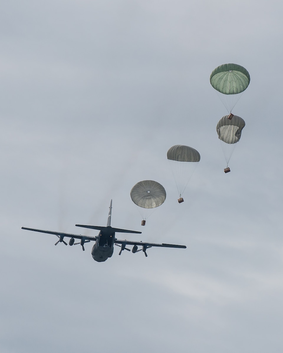 A Kentucky Air National Guard C-130 Hercules aircraft deploys four bundles of cargo into the Ohio River during an aerial demonstration as part of the Thunder Over Louisville airshow in Louisville, Ky., April 13, 2019. Hundreds of thousands of spectators turned out to view the annual event, which has grown to become one of the largest single-day air shows in North America. (U.S. Air National Guard photo by Dale Greer)