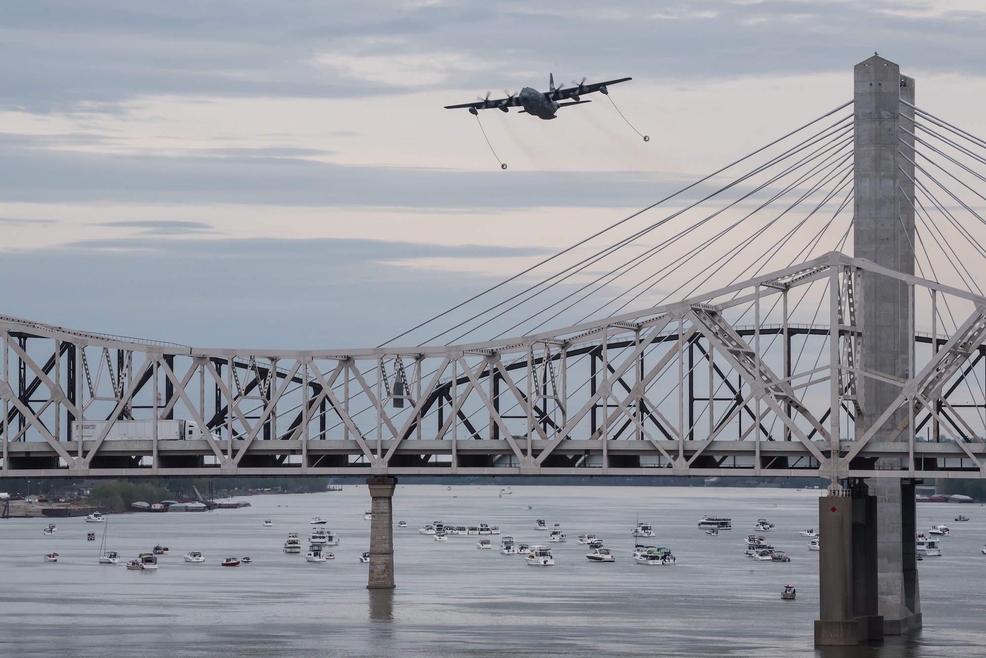 A U.S. Air Force HC-130 Hercules aircraft from Patrick Air Force Base Florida, deploys its refueling drogues over the Ohio River during the Thunder Over Louisville airshow in Louisville, Ky., April 13, 2019. The Kentucky Air National Guard once again served as the base of operations for military aircraft participating in the annual event, which has grown to become one of the largest single-day air shows in North America. (U.S. Air National Guard photo by Dale Greer)