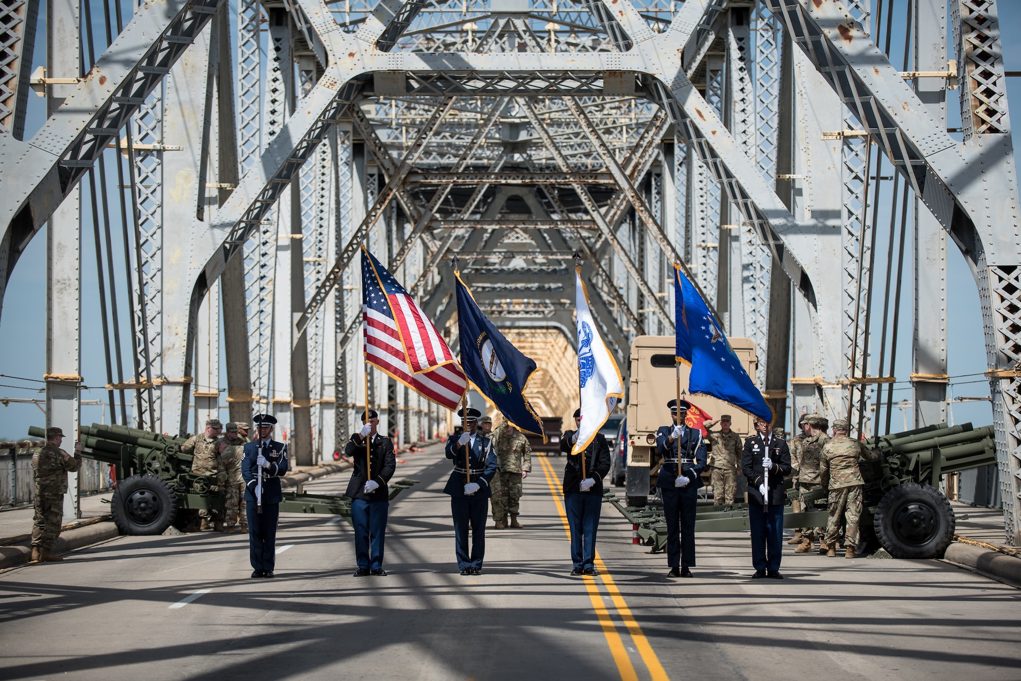 A joint color guard from the Kentucky Army and Air National Guard presents the colors to kick off the Thunder Over Louisville air show in downtown Louisville, Ky., April 13, 2019, as the Kentucky Guard's 138th Field Artillery Brigade stands buy to add cannon fire to the Star Spangled Banner. The annual event, which featured more than two dozen military aircraft, has grown to become one of the largest single-day air shows in North America. (U.S. Air National Guard photo by Dale Greer)
