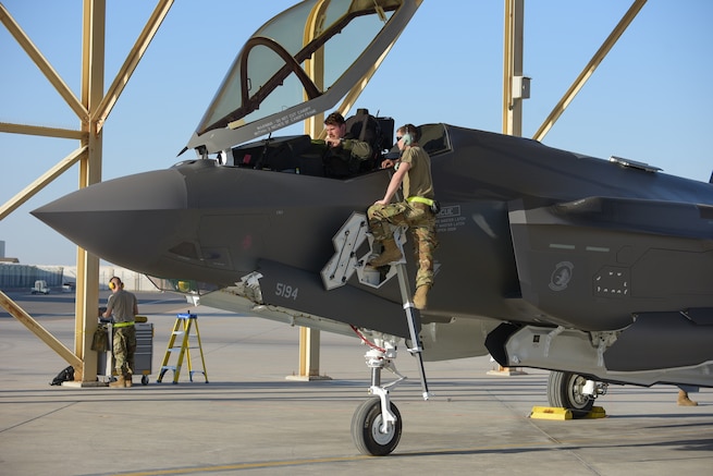 A 380th Air Expeditionary Maintenance Group crew chief meets an F-35A Lightning IIs pilot at Al Dhafra Air Base, United Arab Emirates, April 15, 2019. The F-35A Lightning II is deployed to the Air Forces Central Command Area of Responsibility for the first time in U.S. Air Force history. (U.S. Air Force photo by Staff Sgt. Chris Thornbury)