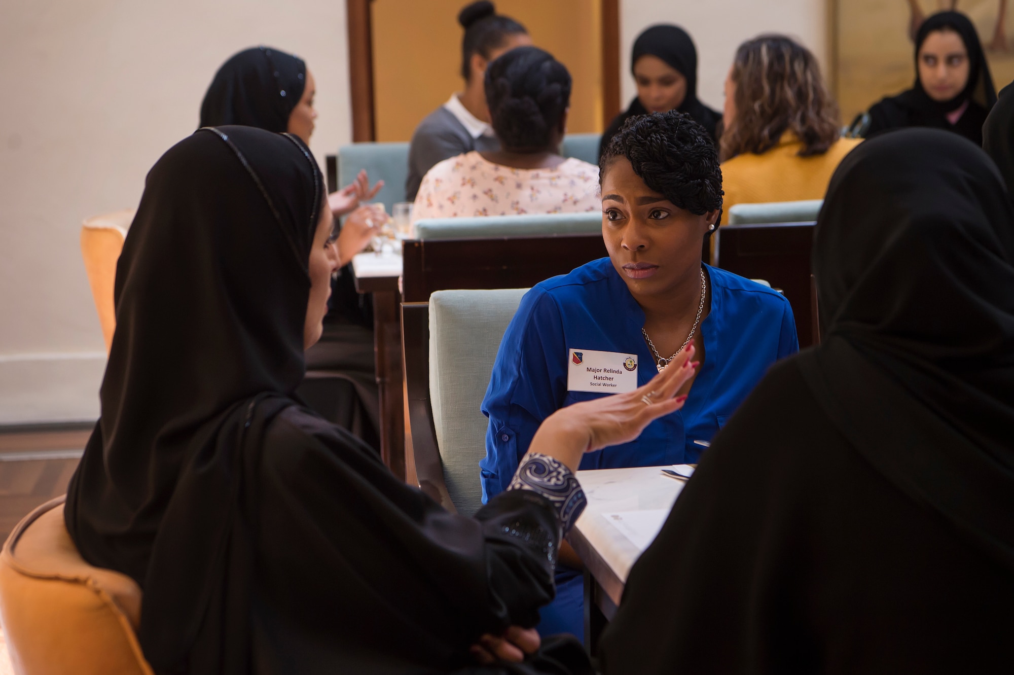 U.S. Air Force Maj. Relinda Hatcher, center, 379th Expeditionary Medical Group specialty services flight commander, talks to women serving in the Qatar Armed Forces during the second Women’s Networking Breakfast March 20, 2019, in Doha, Qatar. The event was designed to give women from both militaries the opportunity to grow personally and professionally, learn about other cultures, share military experiences, and build relationships.