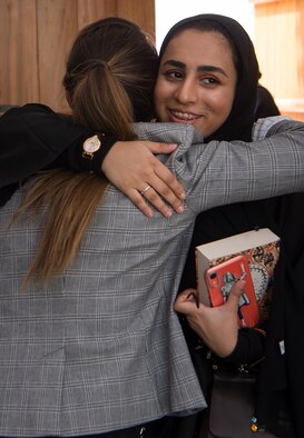 Capt. Hanna Sparks, left, 379th Air Expeditionary Wing sexual assault prevention and response coordinator, embraces Qatar Emiri Air Force Lt. Hind Bajidaph, executive officer to the Qatar Emiri Air Force commander, at the end of the second Women’s Networking Breakfast March 20, 2019, in Doha, Qatar. The event was designed to give women from both militaries the opportunity to grow personally and professionally, learn about other cultures, share military experiences, and build relationships. (U.S. Air Force photo by Tech. Sgt. Christopher Hubenthal)