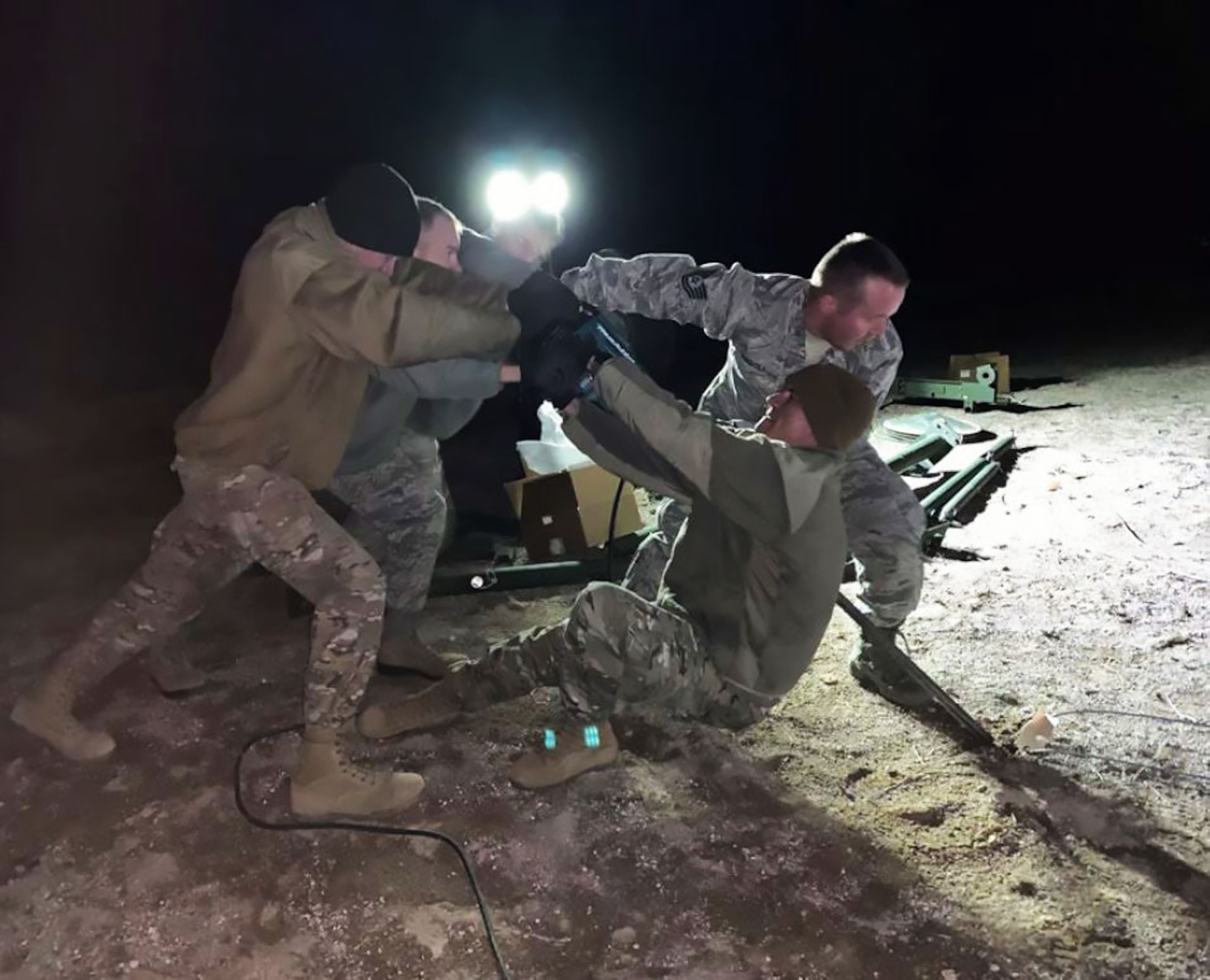 Airmen from the 726th Air Control Squadron drive 99 feet of copper grounding rods and 7,000 feet of electrical cabling into the Nevada soil in less than 72 hours. This preparation was needed to set up the Tactical Operations and Control and Reporting Centers so the TYQ-23A could be fully integrated at Red Flag 19-02. (Courtesy photo).