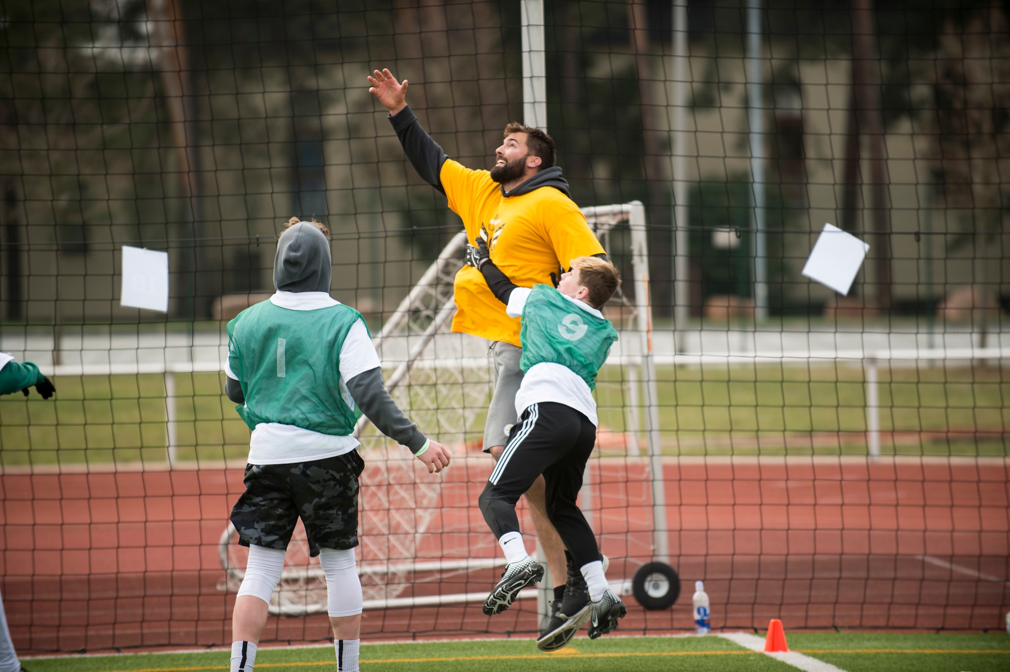 Alejandro Villanueva, Pittsburgh Steelers offensive lineman, jumps to catch a pass during a seven-on-seven football game during his youth football camp at Kaiserslautern High School on Vogelweh Military Complex, Germany, April 13, 2019. Villanueva, a former U.S. Army captain and Army Ranger, returned to Europe to host his first overseas football camp. (U.S. Air Force photo by Staff Sgt. Jonathan Bass)