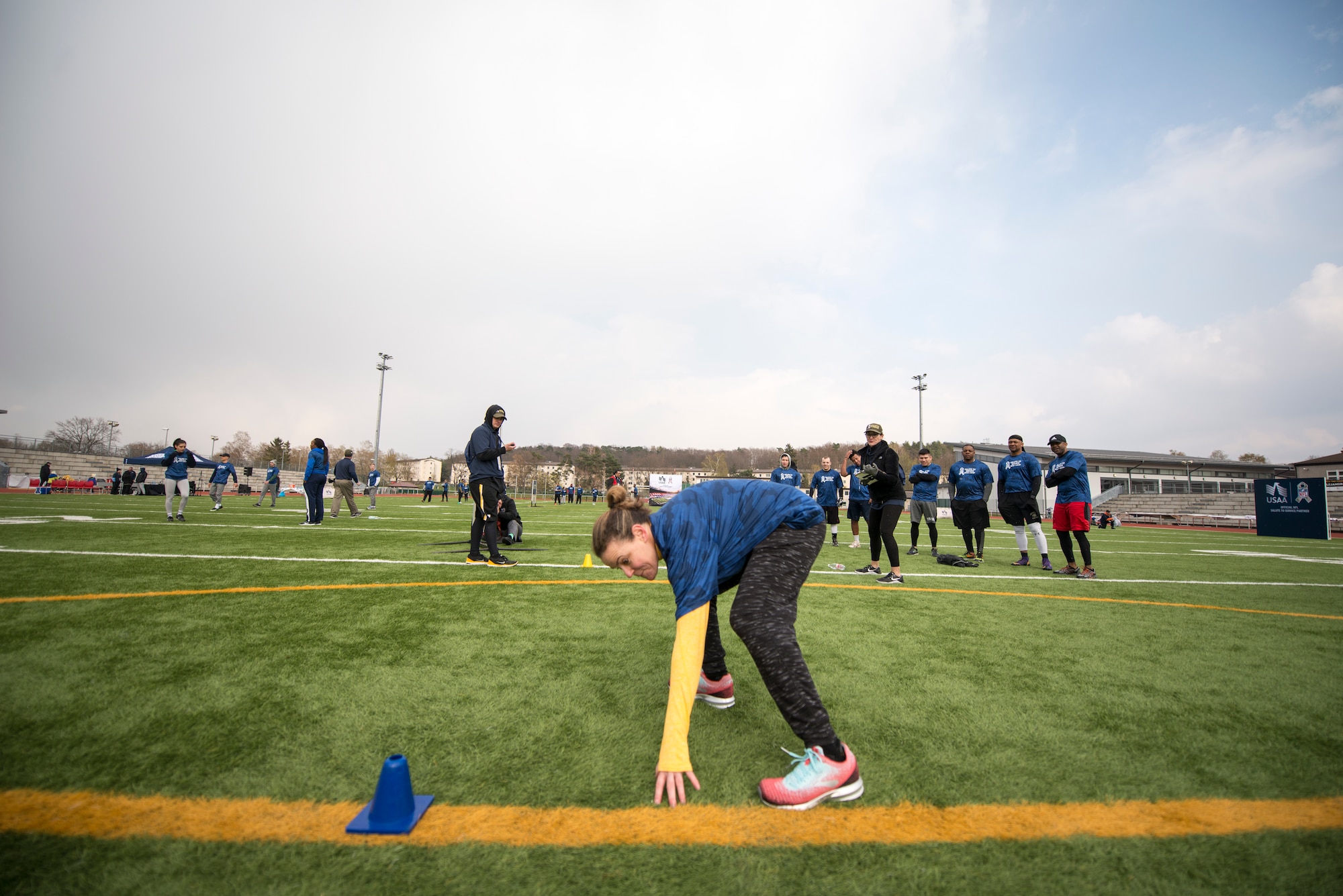 An Alejandro Villanueva football camp attendee runs a three-cone-shuttle drill during a camp at Kaiserslautern High School on Vogelweh Military Complex, Germany, April 13, 2019. Villanueva, Pittsburgh Steelers offensive lineman, hosted two football camps, one for youth, and one for adults. (U.S. Air Force photo by Staff Sgt. Jonathan Bass)