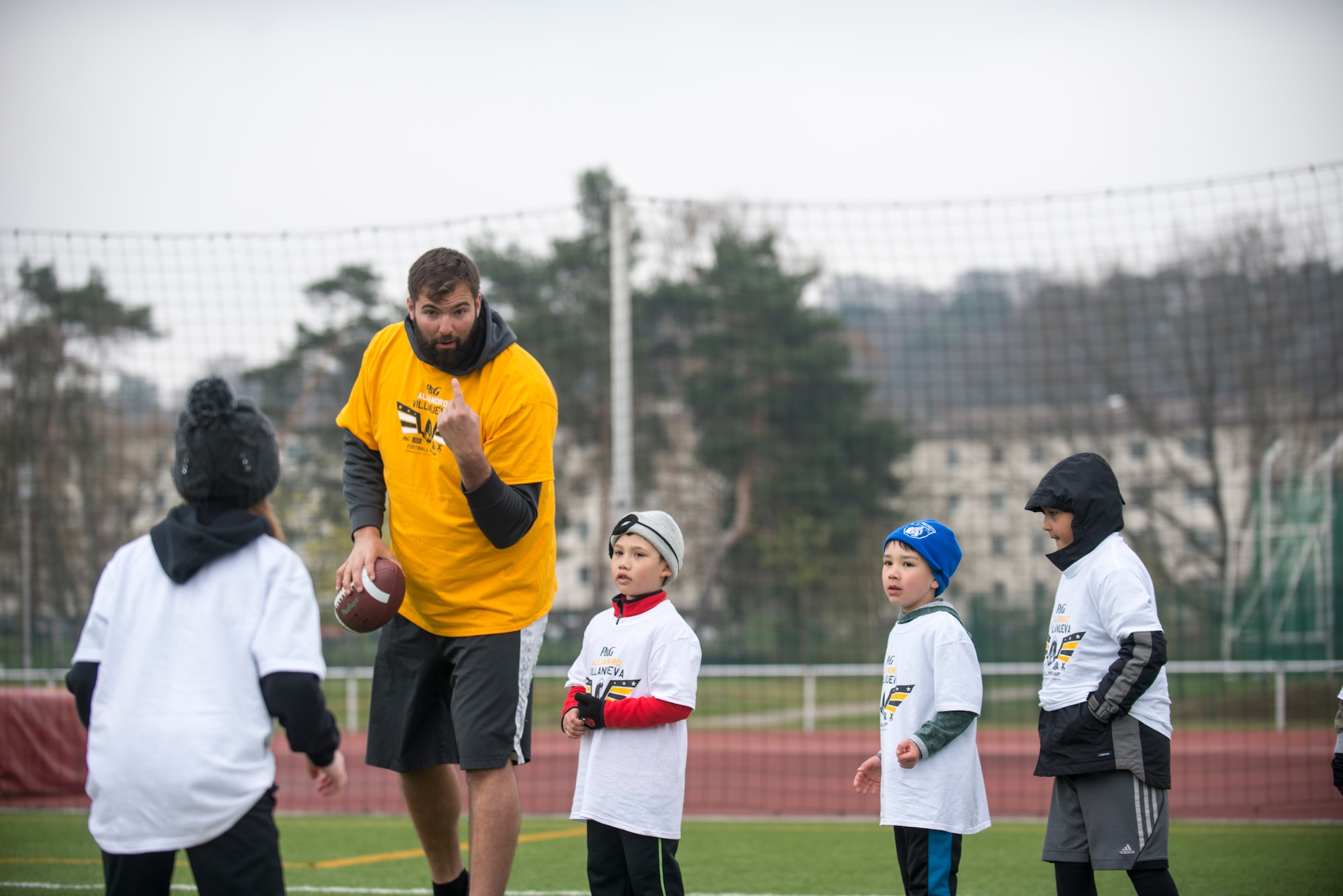 Alejandro Villanueva, Pittsburgh Steelers offensive lineman, coaches one of his camp attendees on defensive drills during his football camp at Kaiserslautern High School on Vogelweh Military Complex, Germany, April 14, 2019. After leaving the U.S. Army, Villanueva worked and signed with the Steelers to play in the NFL. (U.S. Air Force photo by Staff Sgt. Jonathan Bass)
