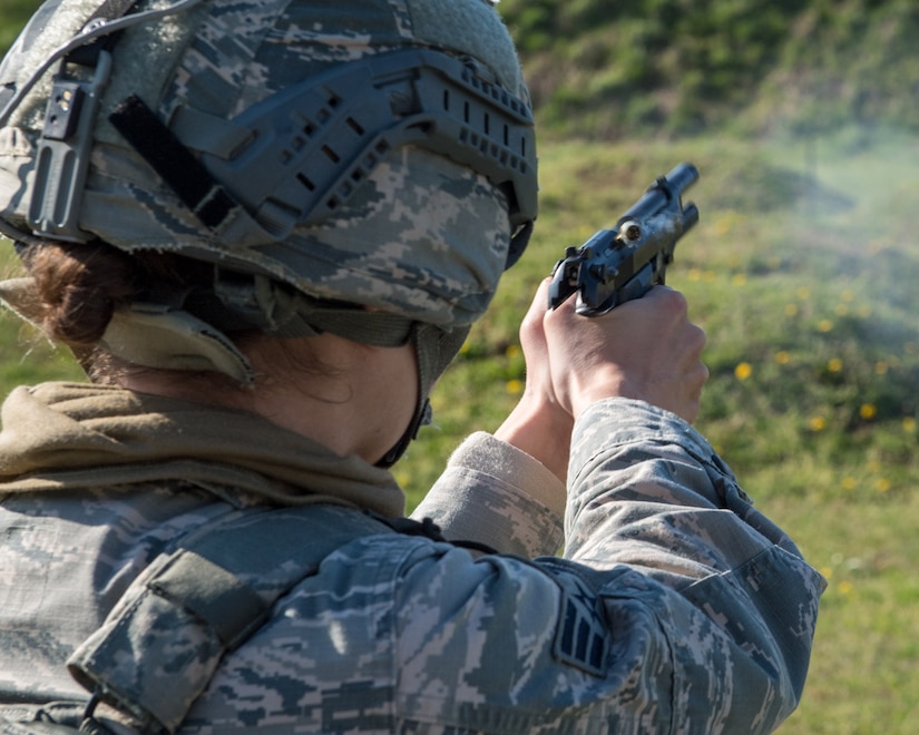 A U.S. Air Force Airman assigned to the 633rd Security Forces Squadron fires an M-9 Berretta during a field training exercise at Joint Base Langley-Eustis, Virginia, April 11, 2019.