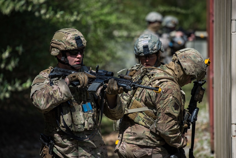 U.S. Air Force Airmen assigned to the 633rd Security Forces Squadron raid a container village during a field training exercise at Joint Base Langley-Eustis, Virginia, April 11, 2019.