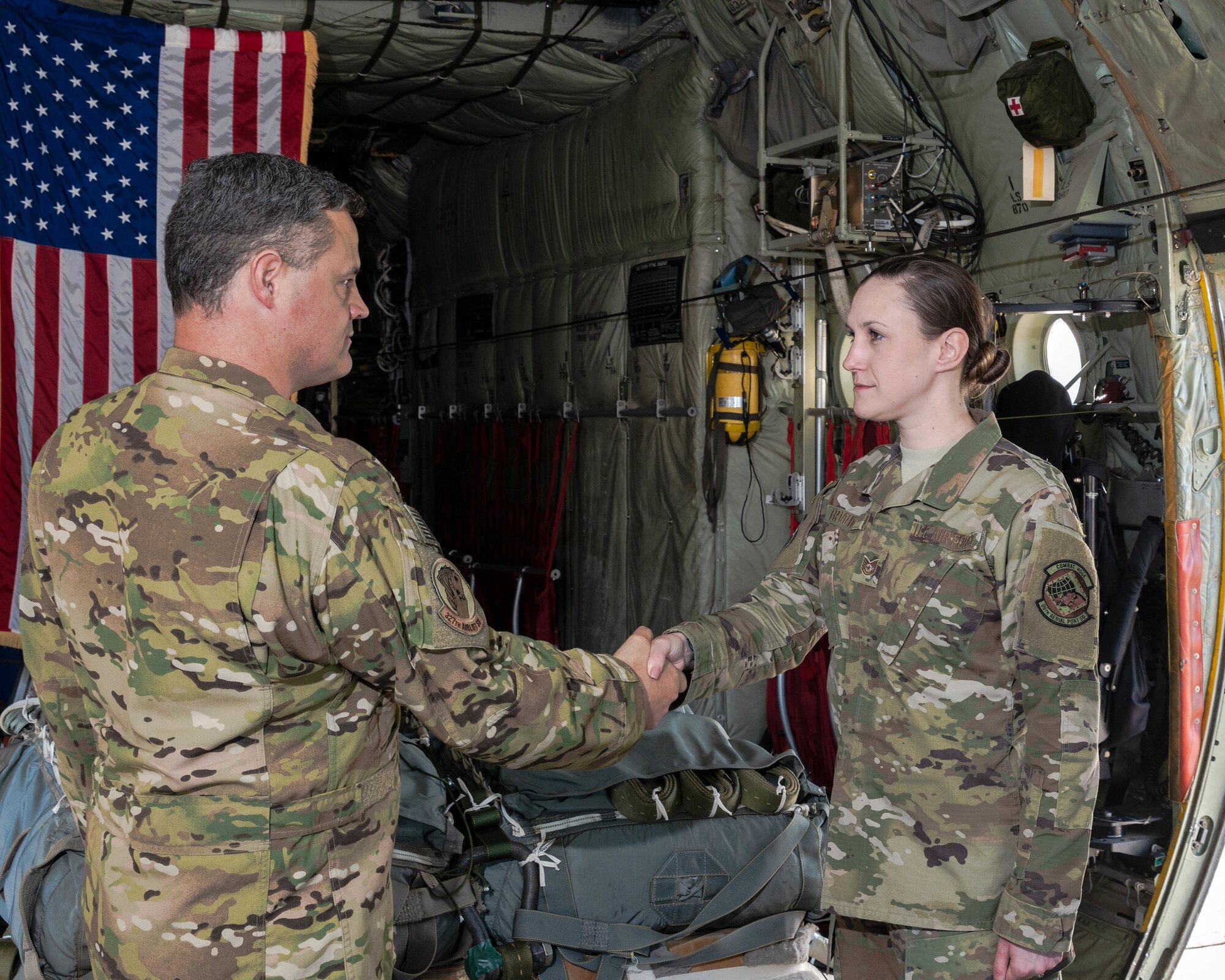 Tech. Sgt. Alex Erwin, 96th Aerial Port Squadron air transportation specialist, reenlists in the cargo area of a C-130J on April 15, 2019.