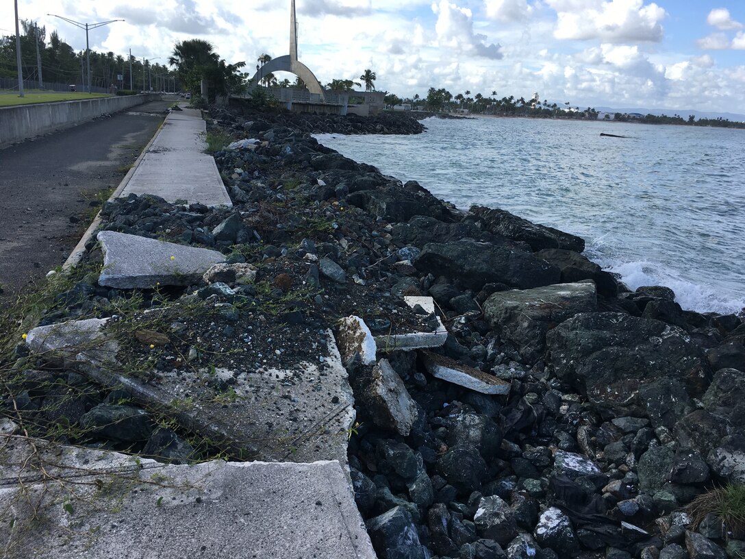 damage sidewalk next to the water