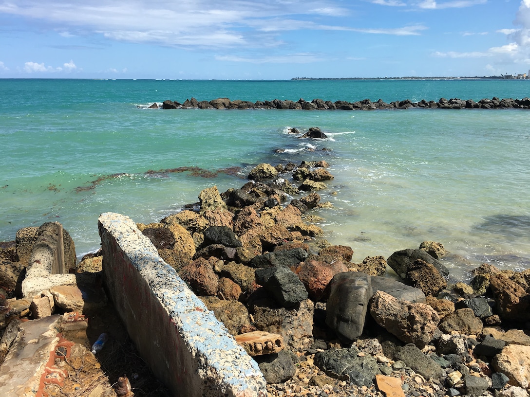 beach shore damage rocks