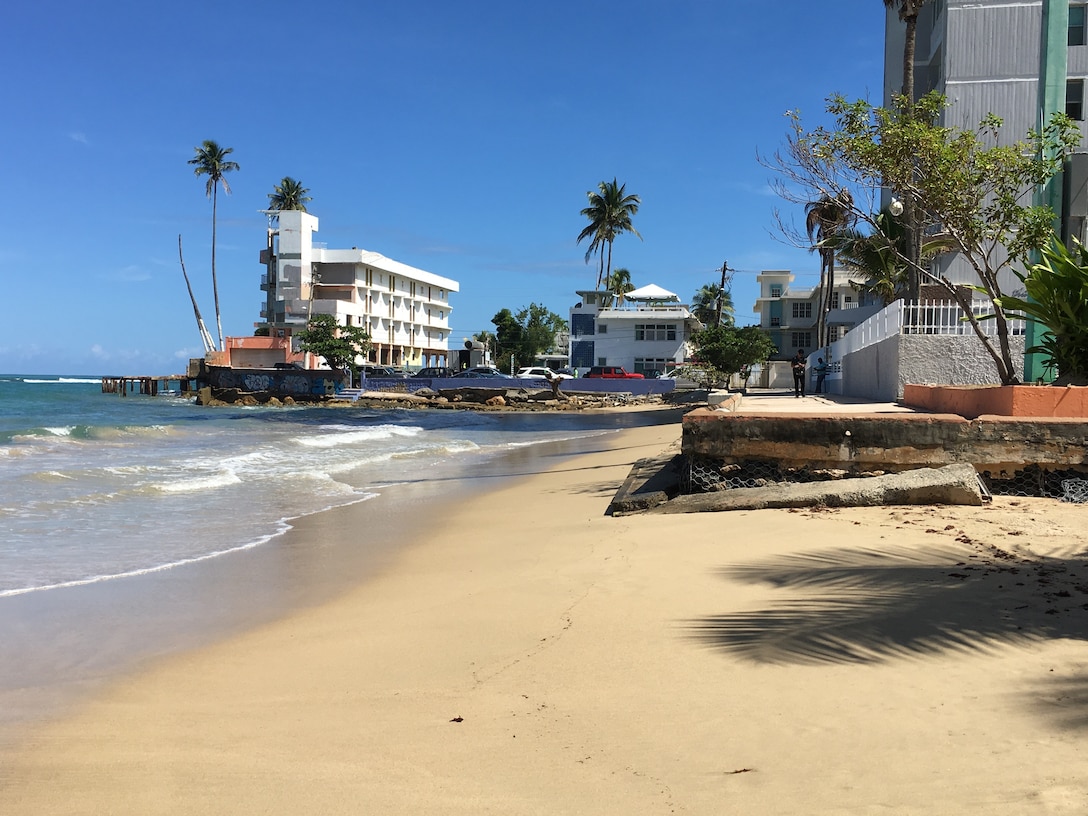 San Juan beach shore, buildings on the background