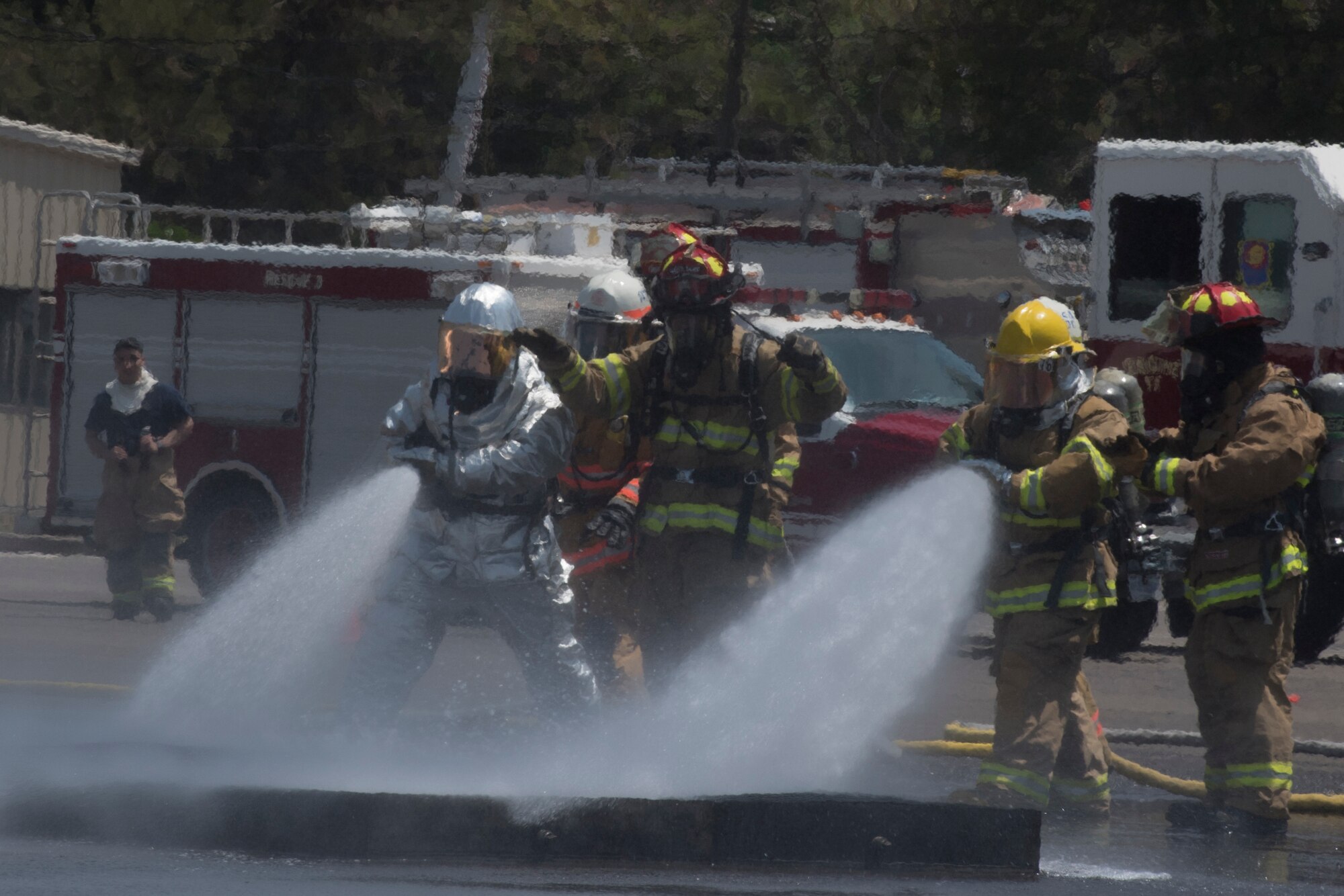 A team comprised of Central American firefighters douse a ground fire during the Central America Sharing Mutual Operational Knowledge and Experiences (CENTAM SMOKE) exercise, April 1, 2019, at Soto Cano Air Base, Honduras. CENTAM SMOKE brought together firefighters from Honduras, Costa Rica, Belize, Guatemala and El Salvador to train with U.S. Air Force members as well as develop bonds and understandings of one another’s culture with team building exercises. The weeklong training included aircraft and structural fires, vehicle extrication, and a firefighter combat challenge. (U.S. Air Force photo by Staff Sgt. Eric Summers Jr.)