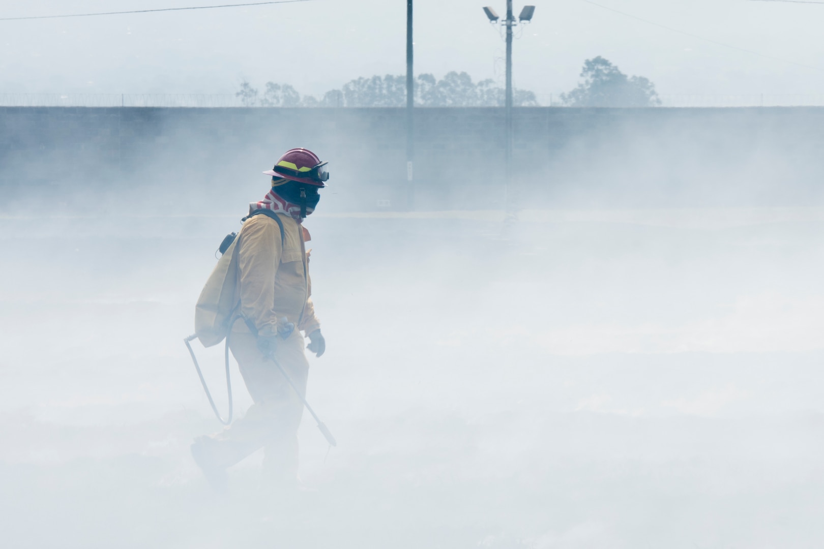 A Central American firefighter surveys the ground for traces of flames after a wildlands fire training during the Central America Sharing Mutual Operational Knowledge and Experiences (CENTAM SMOKE) exercise, April 11, 2019, at Soto Cano Air Base, Honduras. CENTAM SMOKE brought together firefighters from Honduras, Costa Rica, Belize, Guatemala and El Salvador to train with U.S. Air Force members as well as develop bonds and understandings of one another’s culture with team building exercises. The weeklong training included aircraft and structural fires, vehicle extrication, and a firefighter combat challenge. (U.S. Air Force photo by Staff Sgt. Eric Summers Jr.)