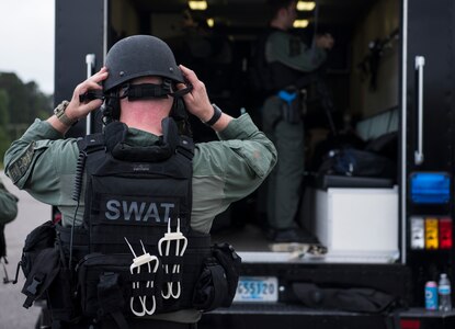 A member of the Charleston County S.W.A.T. team dons his gear for a joint training exercise with Citadel cadets and members of the 628th Security Forces Squadron April 12, 2019, on Naval Weapons Station Charleston, Joint Base Charleston, S.C.
