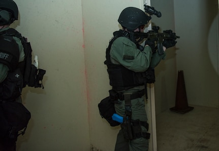A member of the Charleston County S.W.A.T. team clears a room in a shoot house during a joint training exercise with Citadel cadets and members of the 628th Security Forces Squadron April 12, 2019, on Naval Weapons Station Charleston, Joint Base Charleston, S.C.