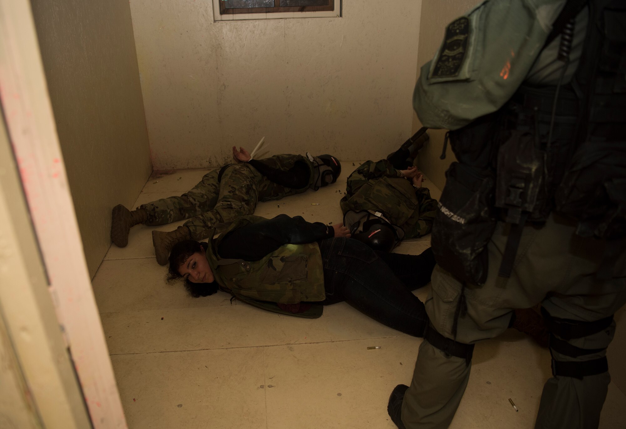 Simulated hostages are detained during a joint training exercise with the Charleston County S.W.A.T. team, Citadel cadets and the 628th Security Forces Squadron April 12, 2019, on Naval Weapons Station Charleston, Joint Base Charleston, S.C.