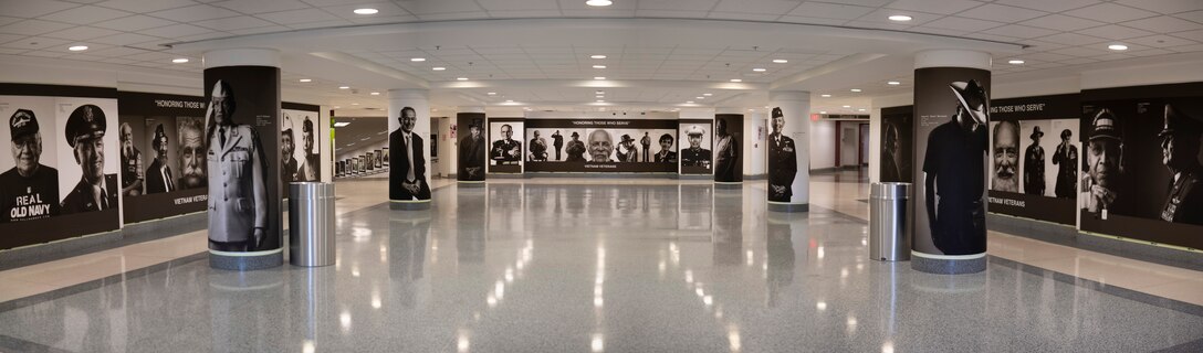 A Pentagon corridor displays photos of veterans.