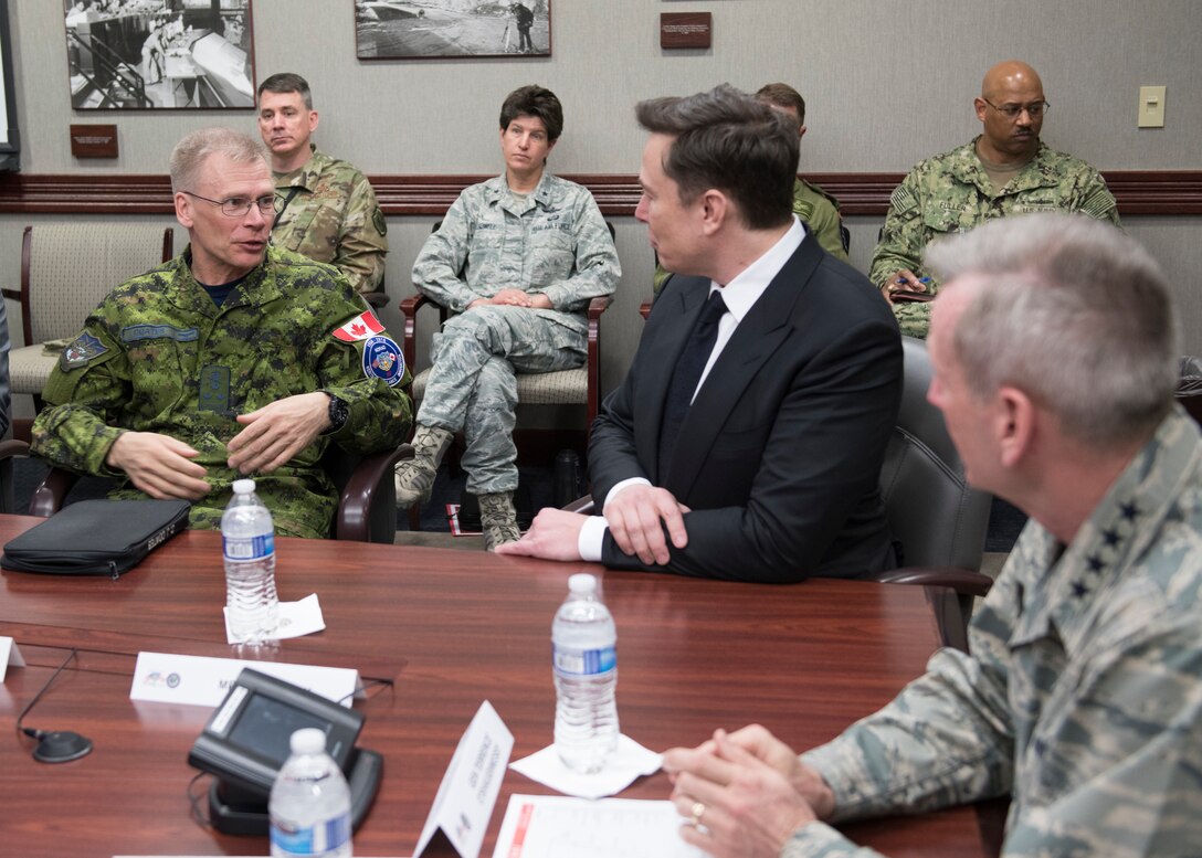 SpaceX CEO Elon Musk discusses U.S. space operations with Royal Canadian Air Force Lieutenant General Christopher Coates, the North American Aerospace Defense Command Deputy Commander and U.S. Air Force General Terrence O’Shaughnessy, the Commander of NORAD and U.S. Northern Command, April 15, 2019. During Musk’s visit to Colorado Springs, Colorado he participated in conversations and round table briefings about future space operations and homeland defense innovation.