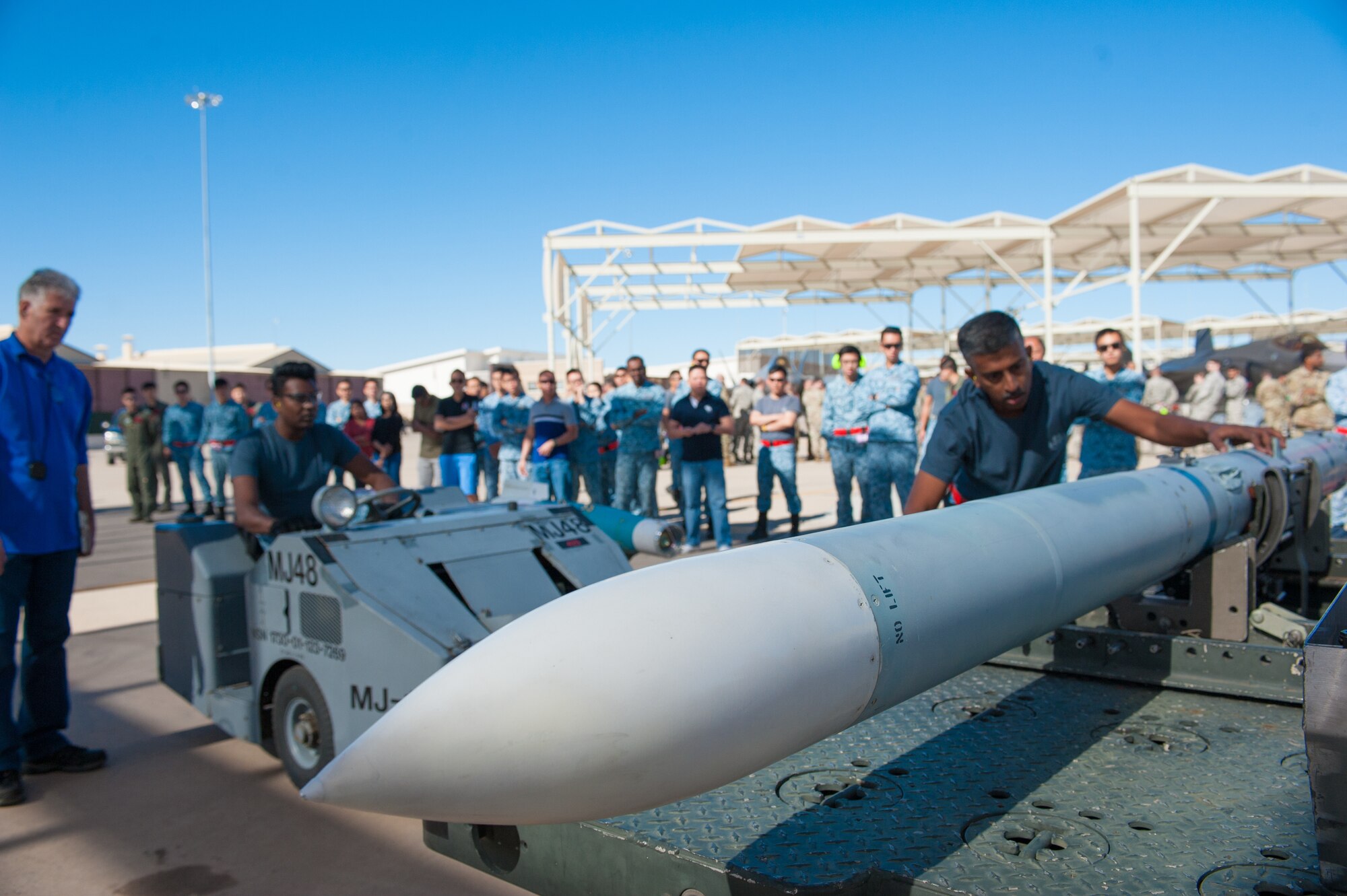 Republic of Singapore Airmen assigned to the 425th Fighter Squadron prepare an inert missile for loading onto an F-16 Fighting Falcon during the 1st Quarter Load Crew Competition, April 11, 2019, at Luke Air Force Base, Ariz.