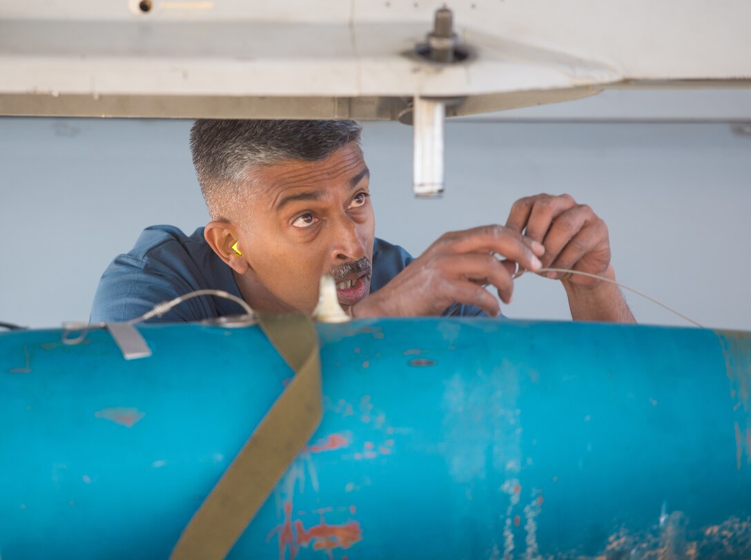 A Republic of Singapore Airman assigned to the 425th Fighter Squadron prepares an inert bomb to be loaded onto an F-16 Fighting Falcon during the 1st Quarter Load Crew Competition, April 11, 2019, at Luke Air Force Base, Ariz.