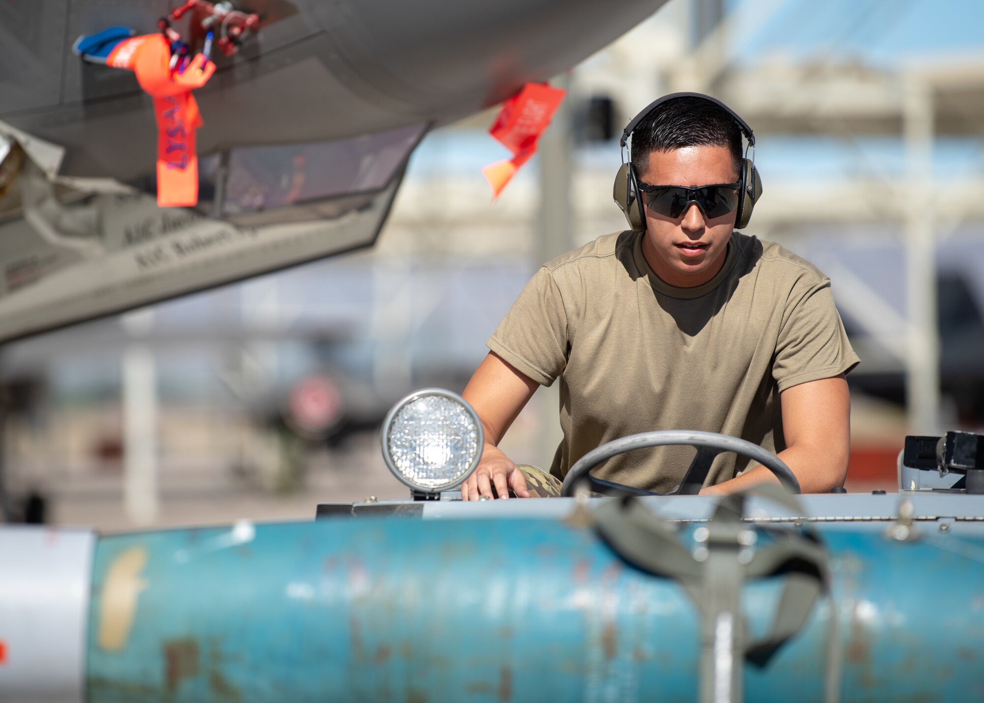 Airman 1st Class Talon Nichols, 62nd Aircraft Maintenance Unit weapons load crew member, drives a jammer during the 1st quarter Load Crew Competition, April 11, 2019, at Luke Air Force Base, Ariz.