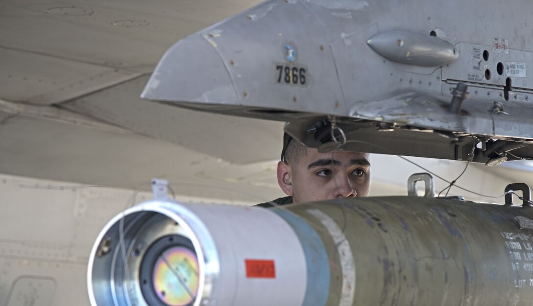 Airman 1st Class Justin Duran, 310th Aircraft Maintenance Unit weapons load crew member, prepares munitions on an F-16 Fighting Falcon during the 1st Quarter Load Crew Competition, April 11, 2019, at Luke Air Force Base, Ariz.