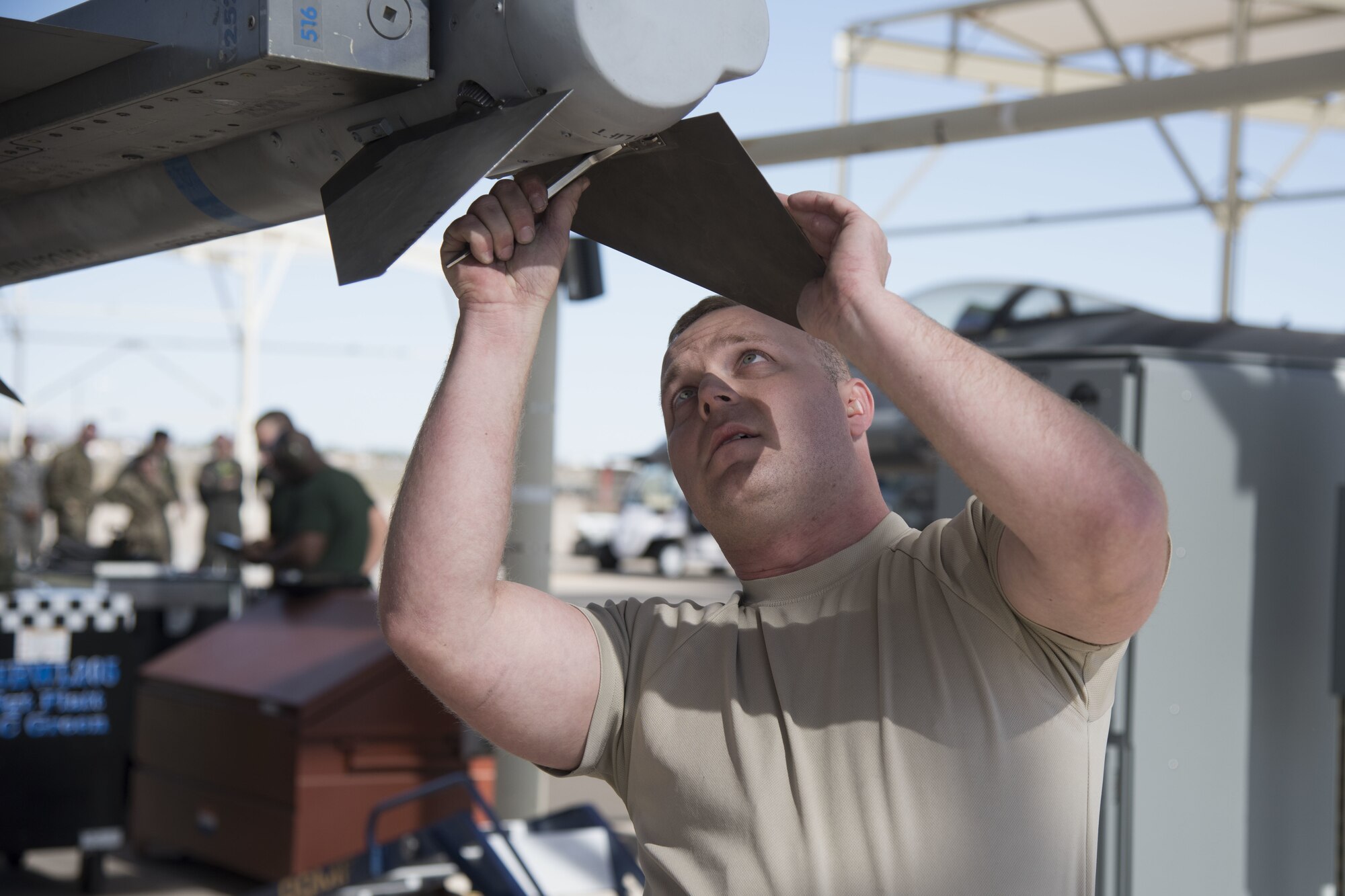 Staff Sgt. Joshua Mendenhall, 309th Aircraft Maintenance Unit weapons load crew member, attaches fins to an inert missile during the 1st Quarter Load Crew Competition, April 11, 2019, at Luke Air Force Base, Ariz.